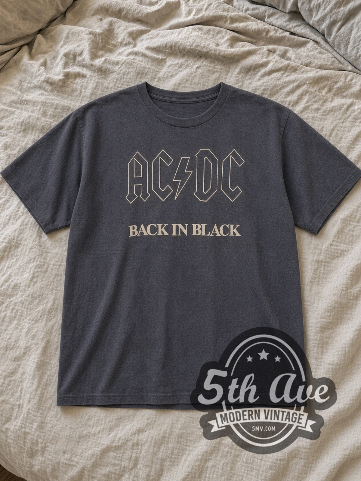 Charcoal AC/DC Back in Black Vintage Band T-Shirt laid flat on a linen bed