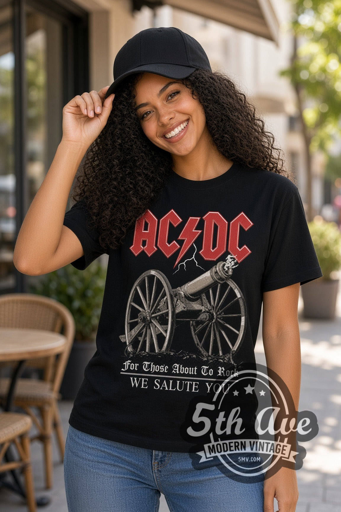Woman wearing AC/DC For Those About to Rock Cannon double stitched black graphic tee
