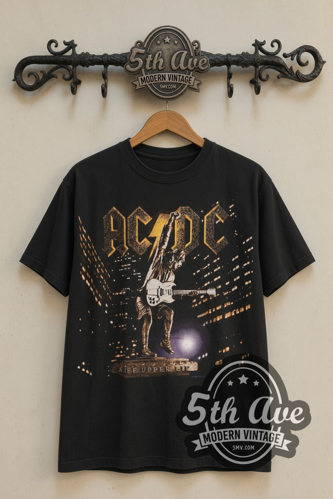 AC/DC Stiff Upper Lip Angus Statue Tour band t-shirt front on 5th Ave iron rack