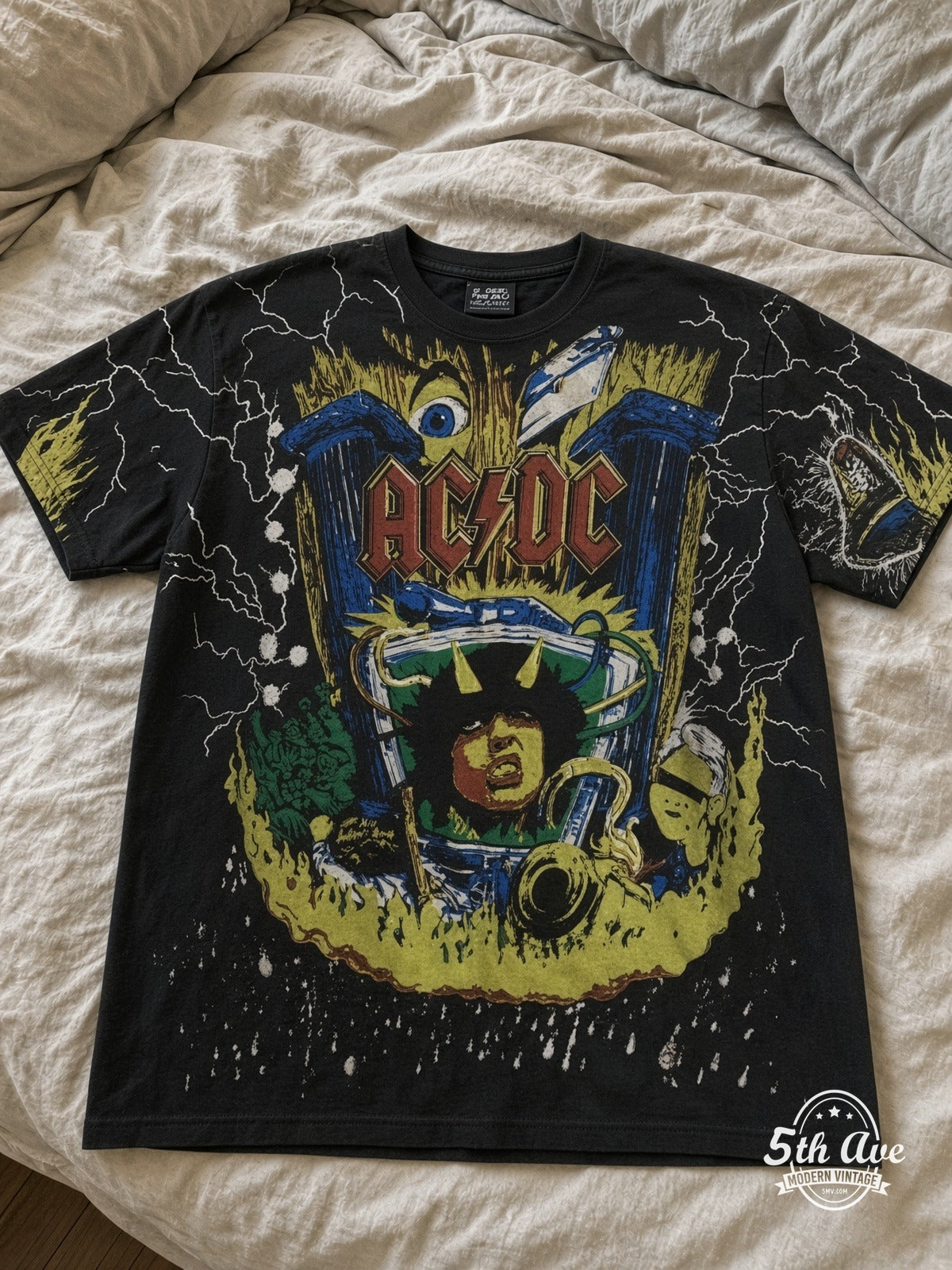 AC/DC Angus V Graphic Black all over print vintage tee laid on bed