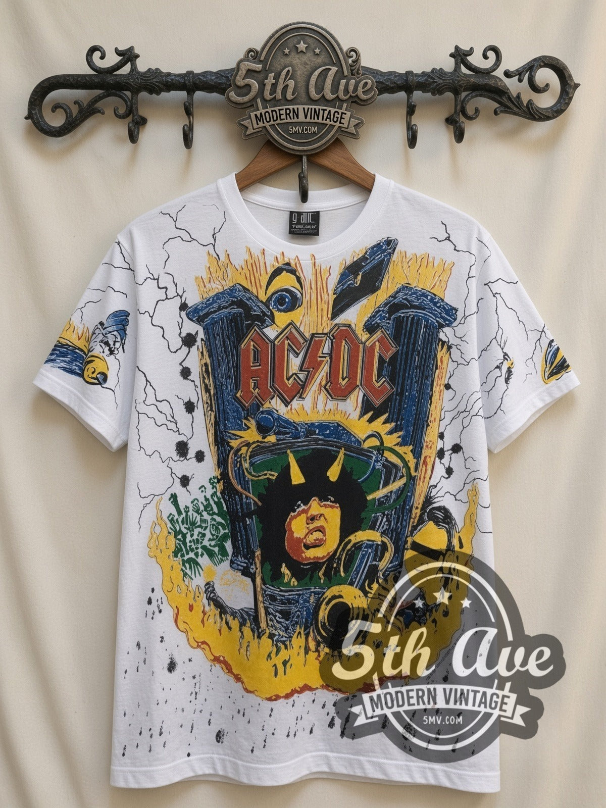 AC/DC Angus V Graphic all-over-print vintage band t-shirt in white, front view on a display rack