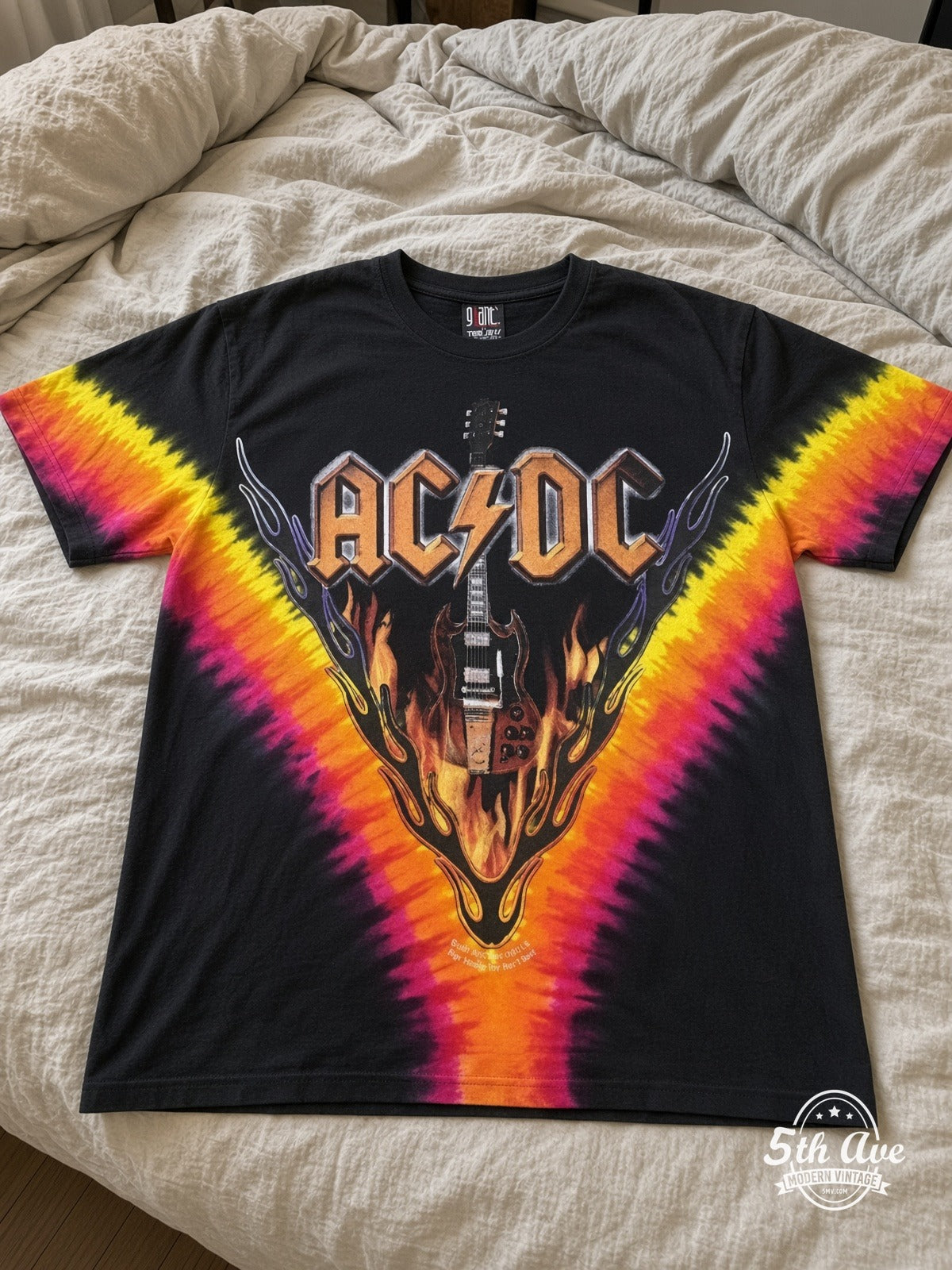 AC/DC Hells Bells Tie-Dye V all over print vintage tee laid on bed
