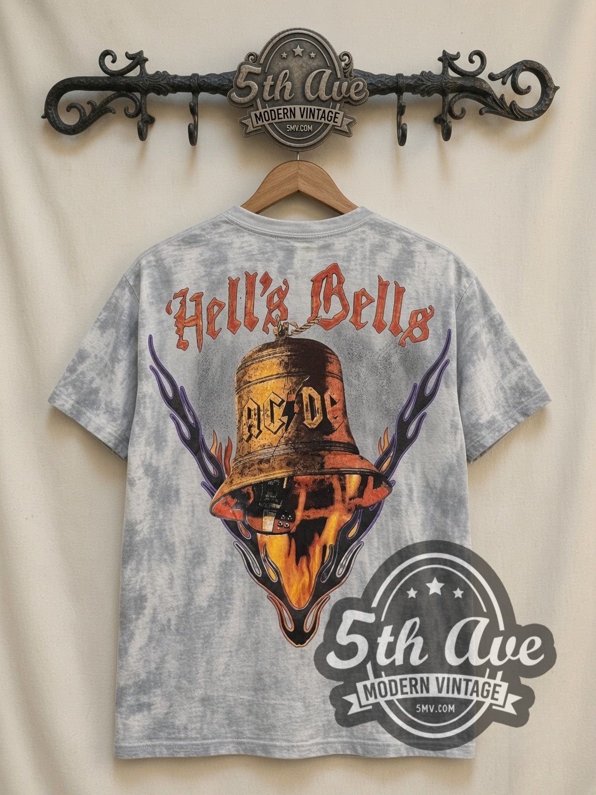 AC/DC Flaming Winged Guitar Tie-Dye V Grey all-over-print vintage band t-shirt, back view on a display rack