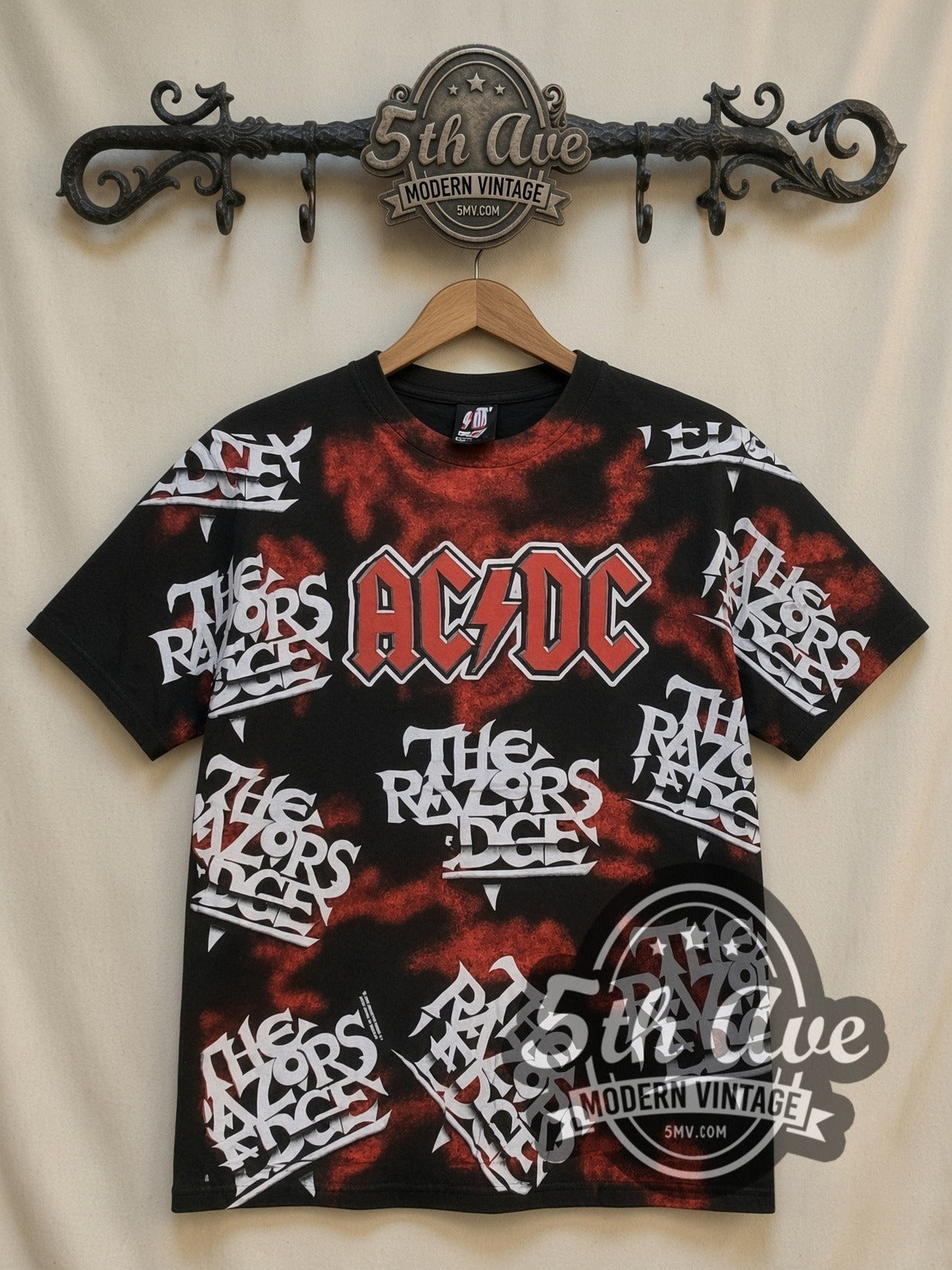 AC/DC Razors Edge Logo Collage all-over-print vintage band t-shirt in black, front view on a display rack