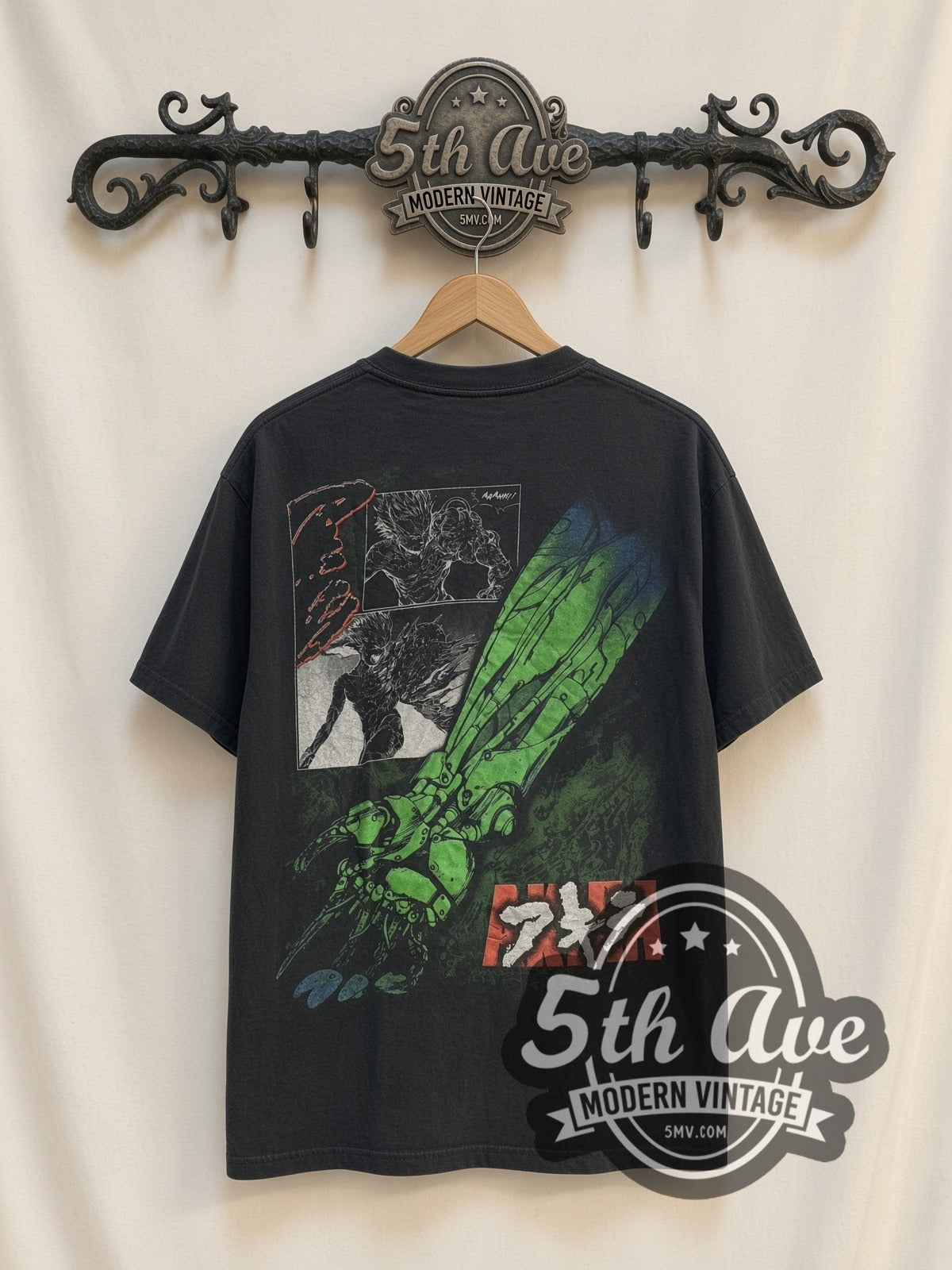 Akira Green Mutated Tetsuo vintage graphic t-shirt, back view on a display rack