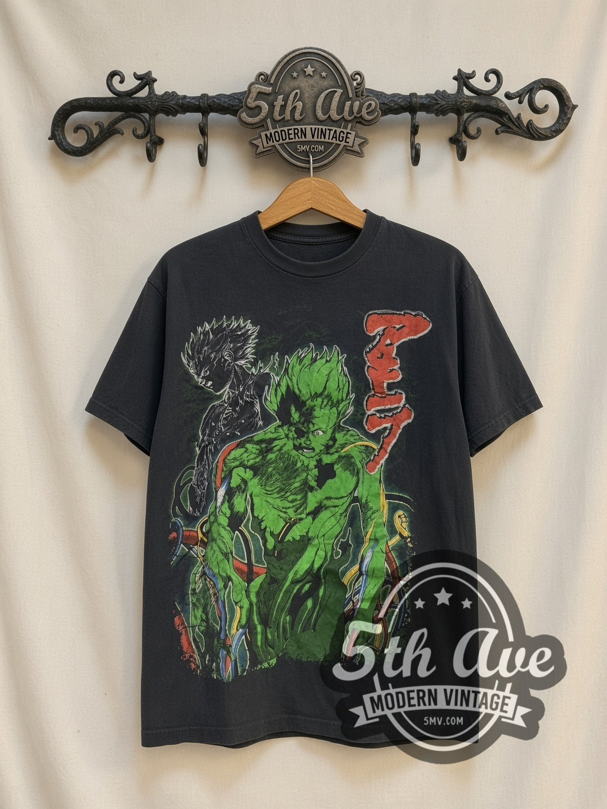 Akira Green Mutated Tetsuo vintage graphic t-shirt, front view on a display rack