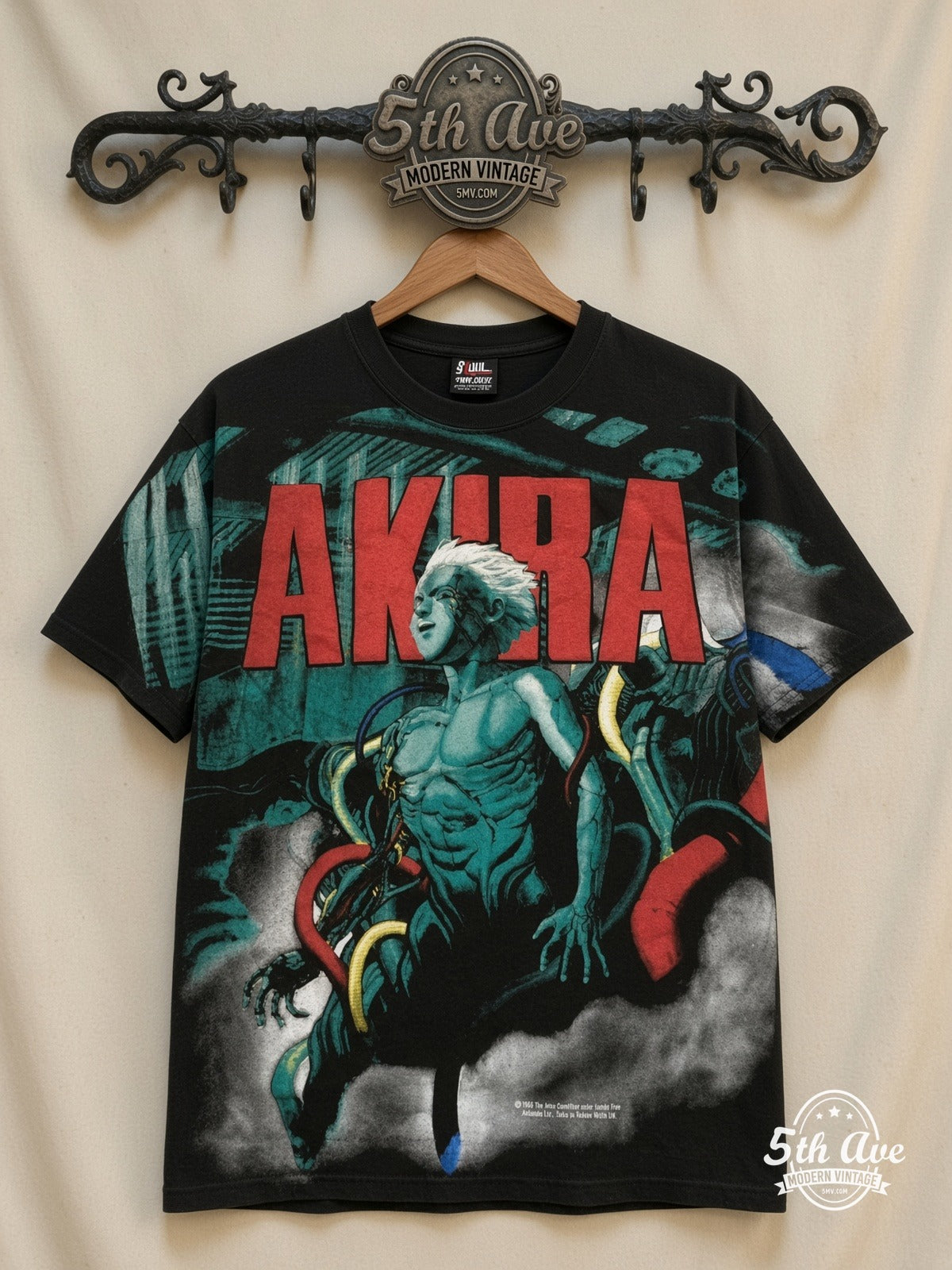 Akira Teal Character all over print vintage band t-shirt front on cream 5th Ave rack