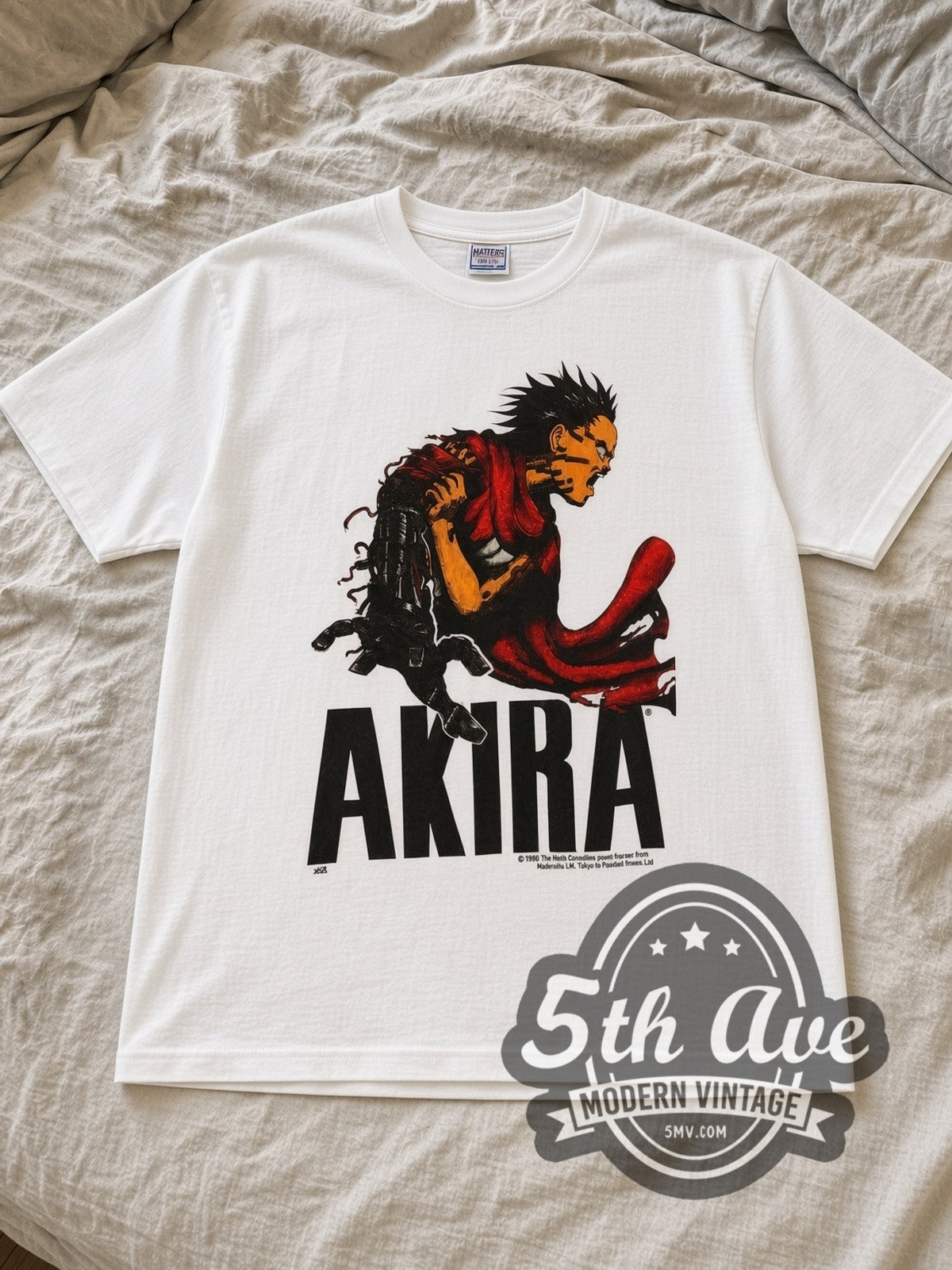 White Akira Tetsuo Shima Vintage Anime T-Shirt laid flat on a linen bed