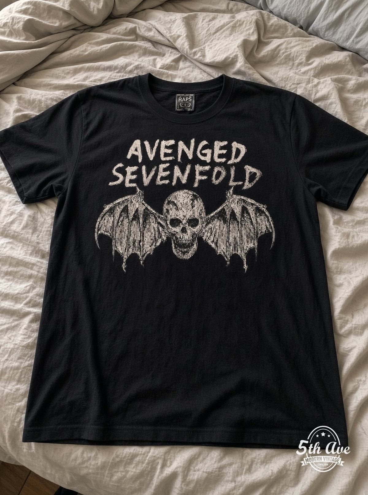 Avenged Sevenfold Deathbat vintage t-shirt laid on bed