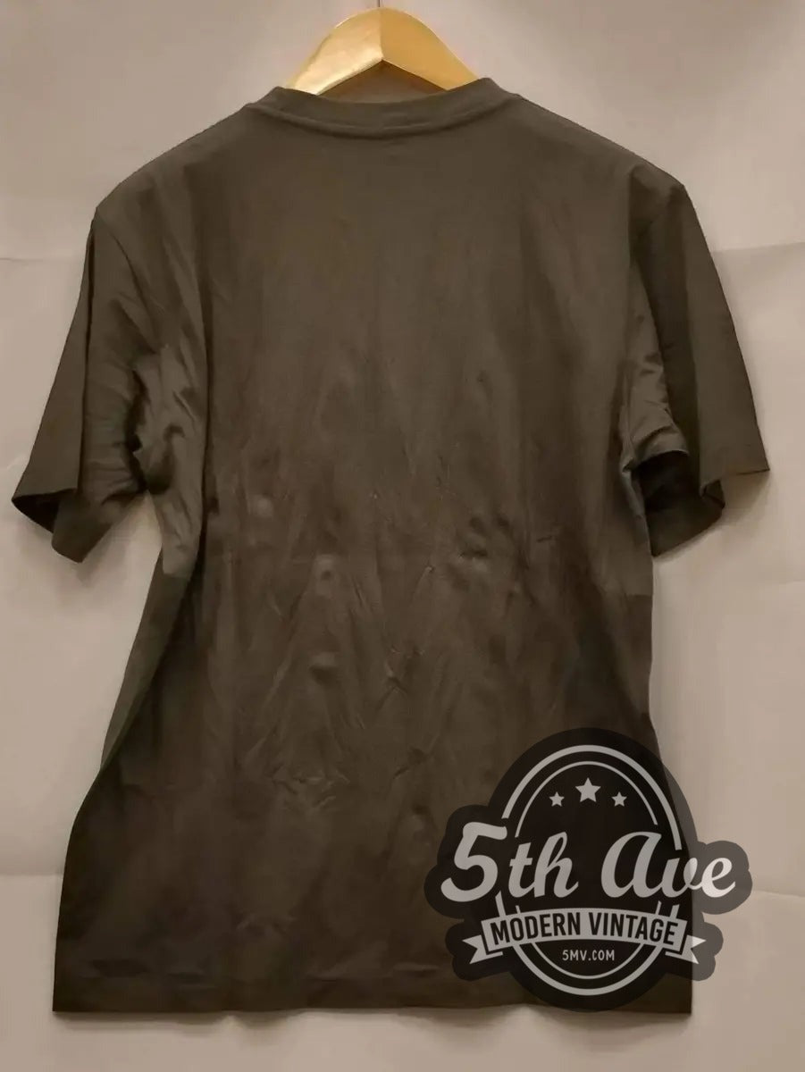 Creedence Clearwater Revival – Cosmo's Factory vintage band t-shirt hanging on a hanger