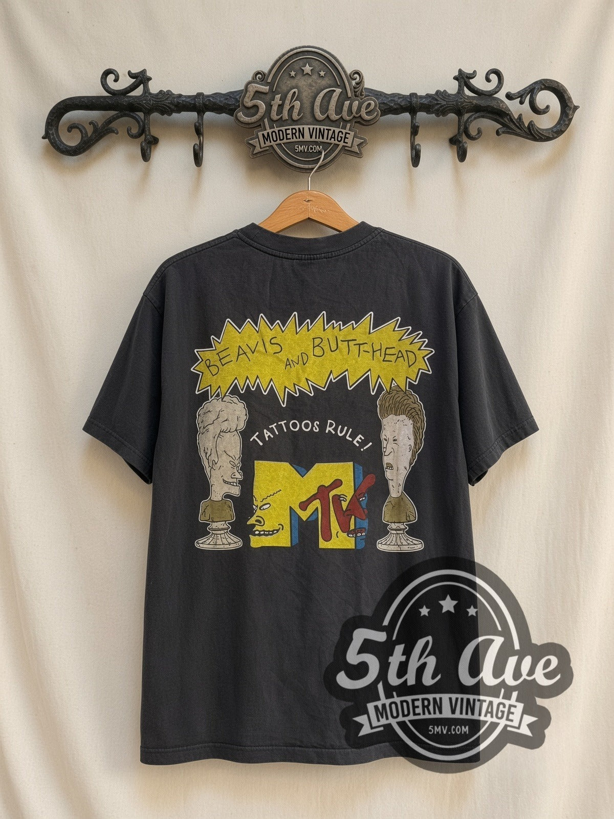 Beavis and Butt-Head Tattoos Rule vintage cartoon t-shirt, back view on a display rack