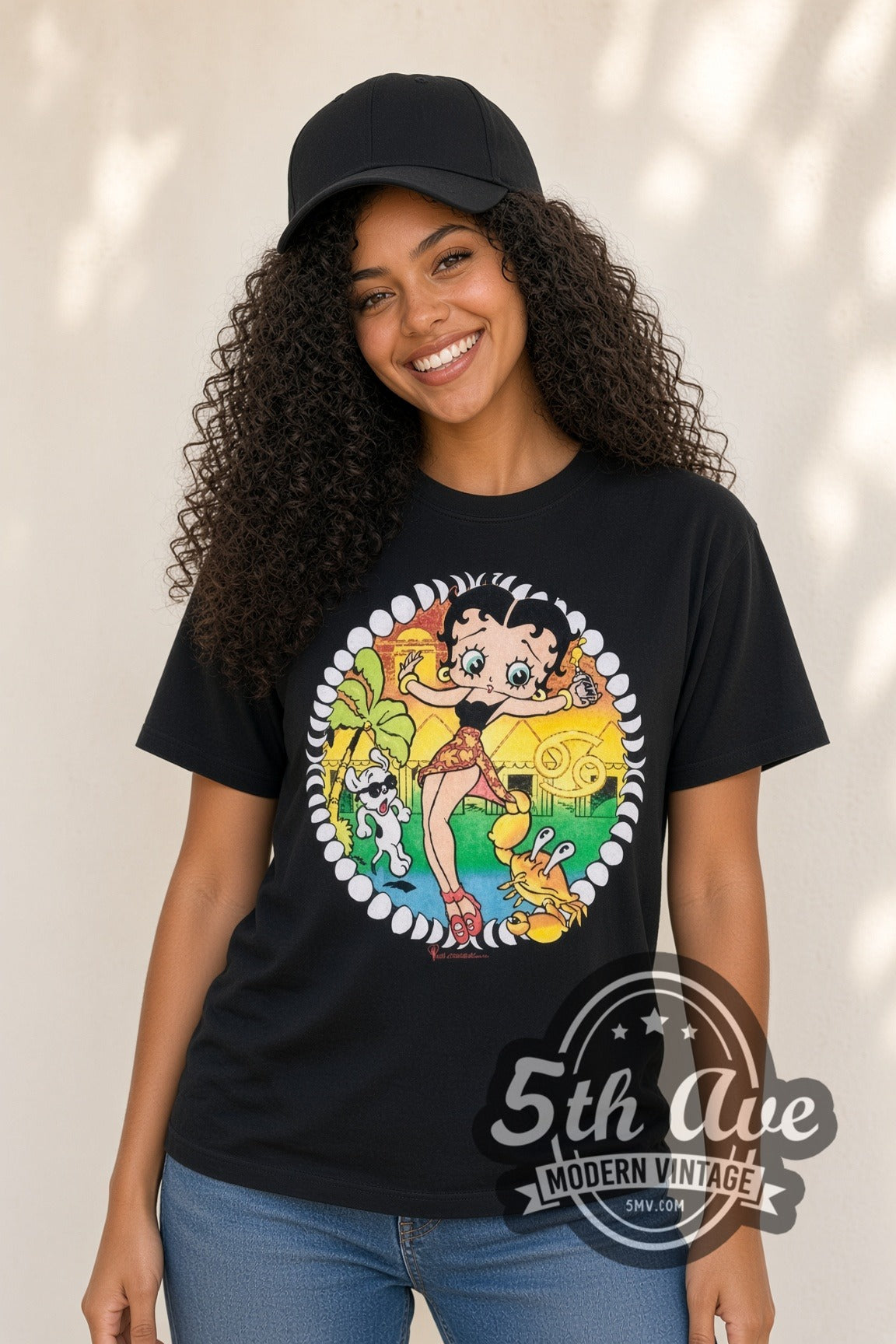 Model wearing the Betty Boop Beach Crab Floral Circle cartoon tee in black