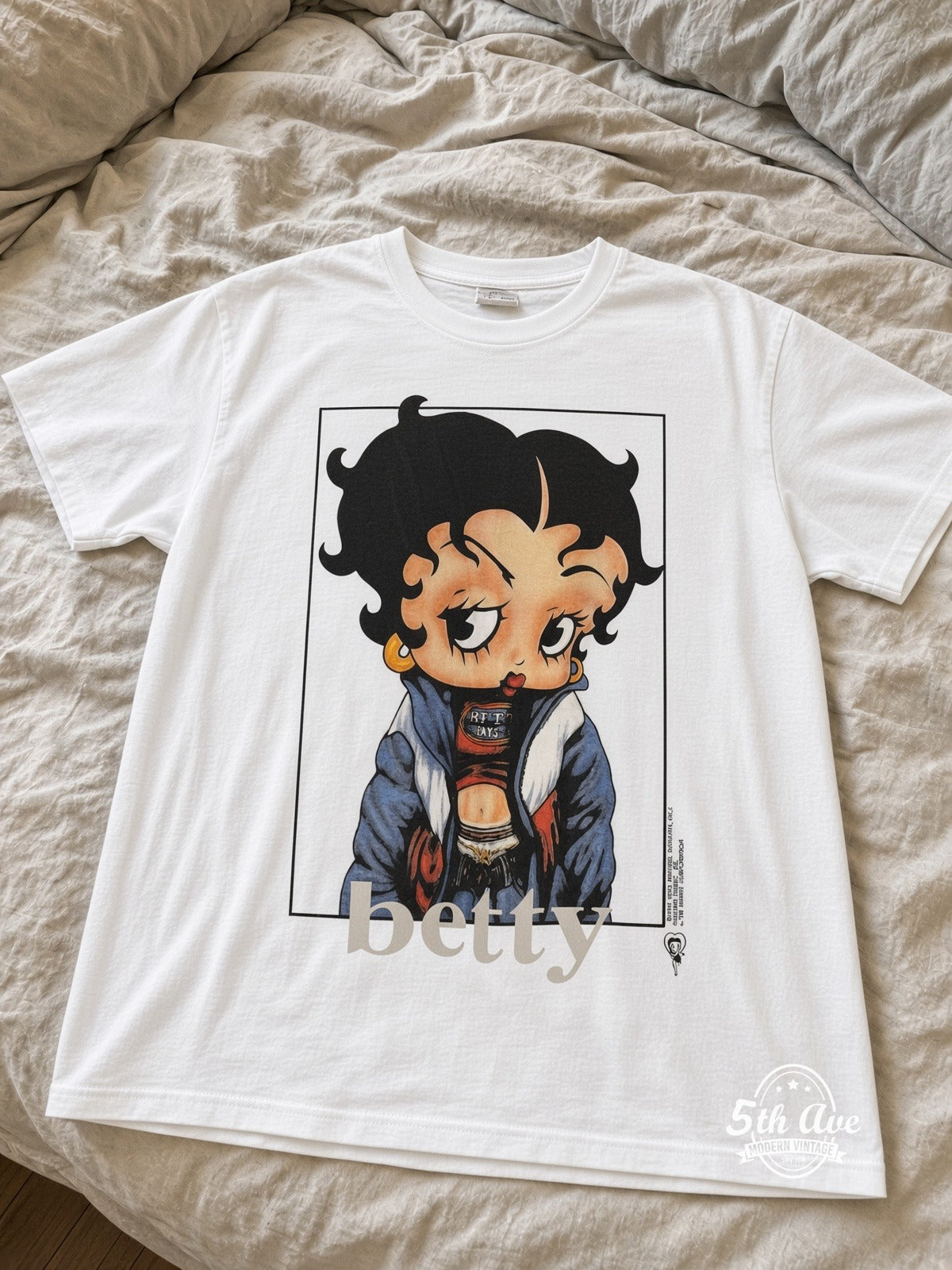 Betty Boop Blue Puffer Jacket Urban Portrait vintage tee laid on bed