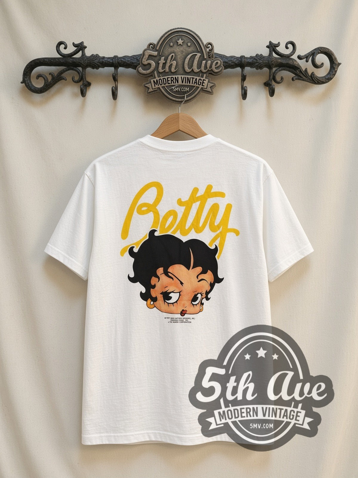 Betty Boop Blue Puffer Jacket vintage cartoon t-shirt, back view on a display rack
