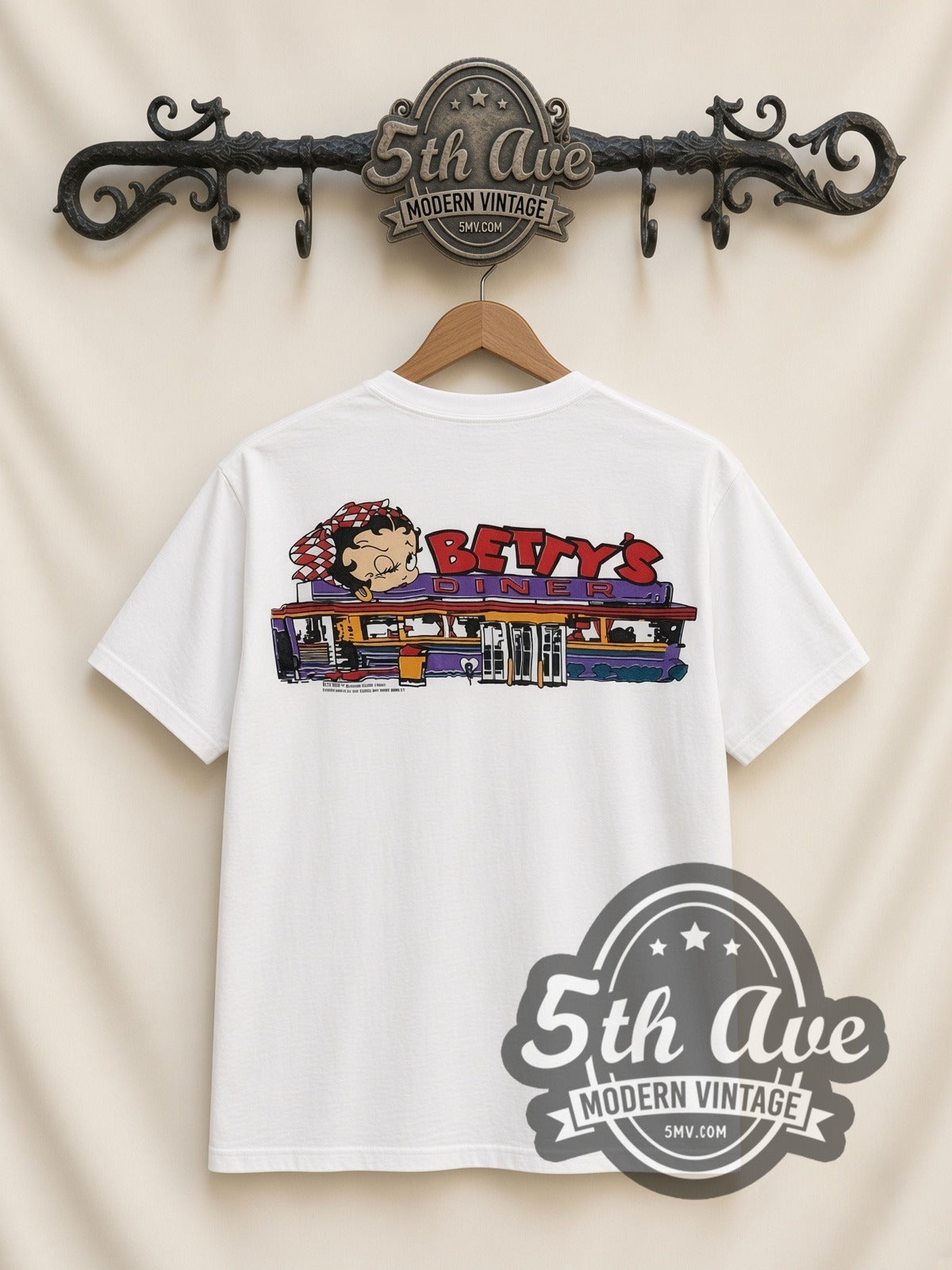 Betty Boop Checkered Dress Abstract all-over-print vintage cartoon t-shirt in white, back view on a display rack