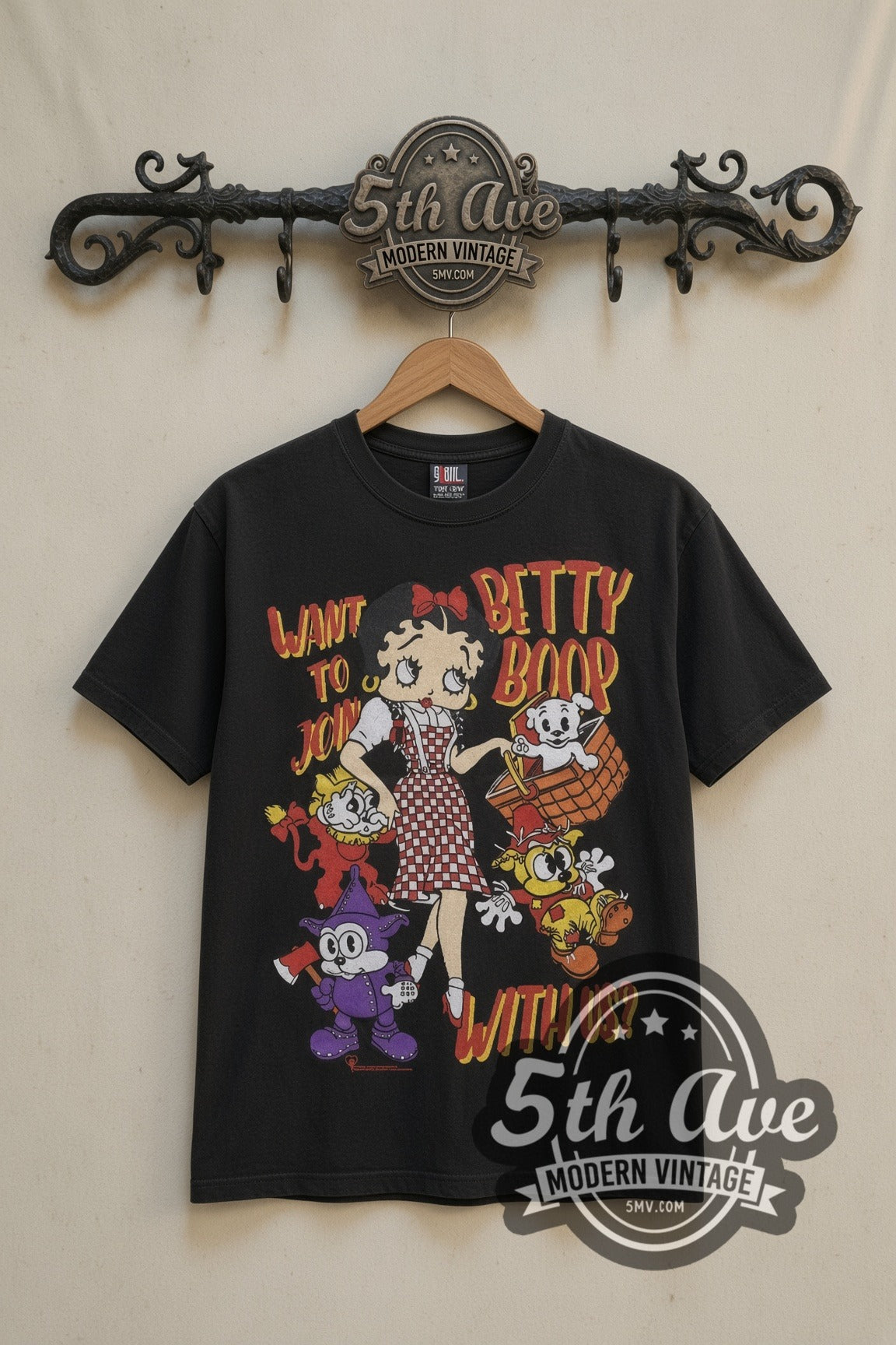Betty Boop Happy Holidays cartoon tee in black, front view on a display rack