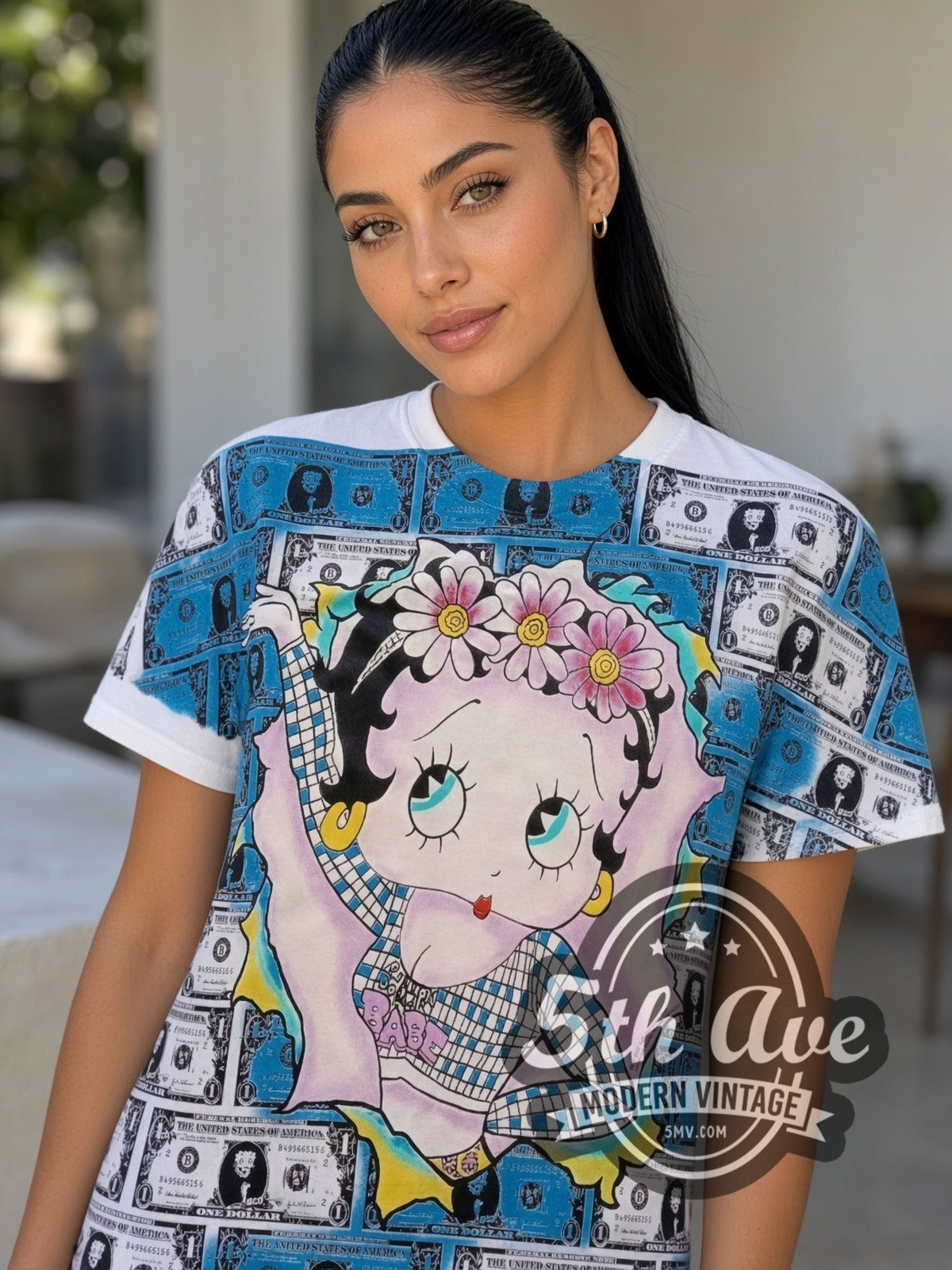 Model wearing the Betty Boop Hundred Dollar Bills all-over-print vintage cartoon t-shirt in white