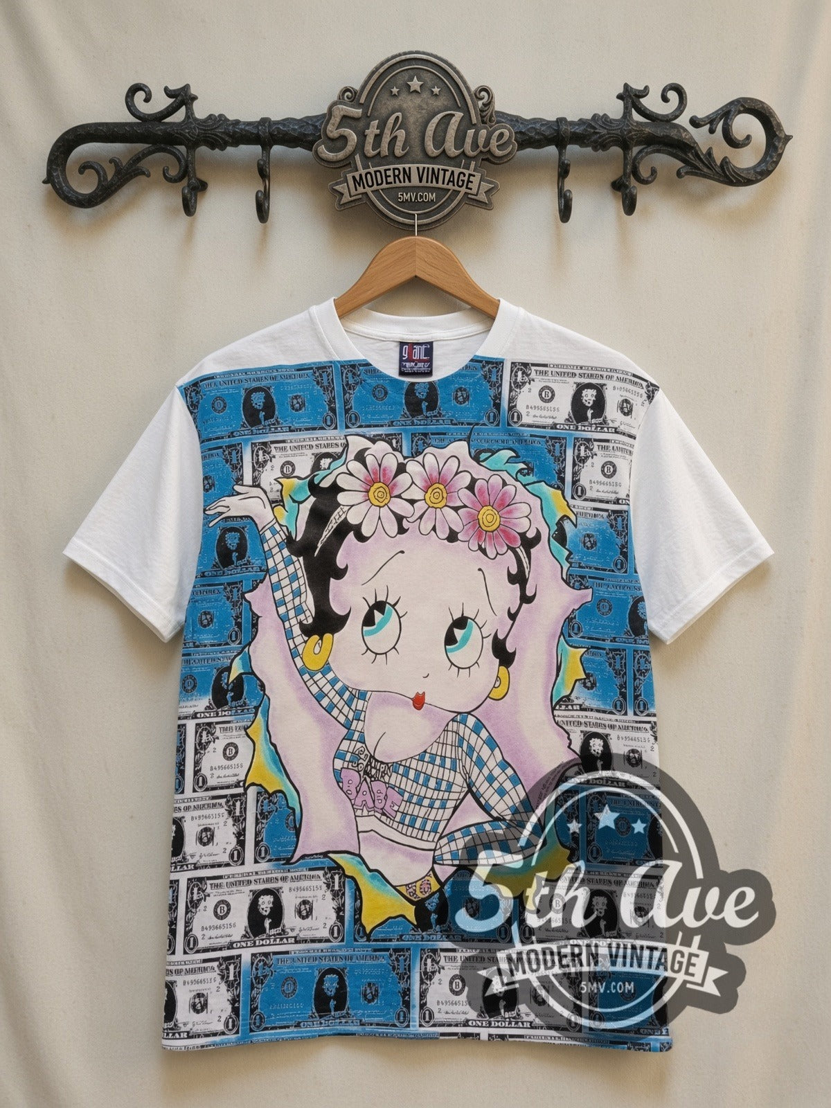 Betty Boop Hundred Dollar Bills all-over-print vintage cartoon t-shirt in white, front view on a display rack