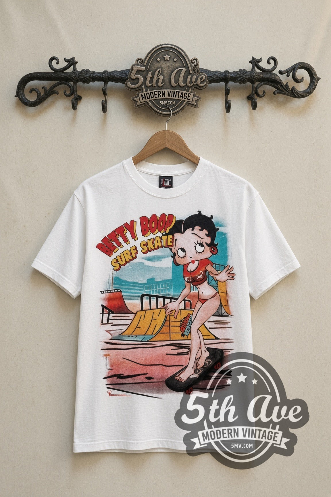 Betty Boop I'm Good at Surf Skate cartoon tee in white, front view on a display rack