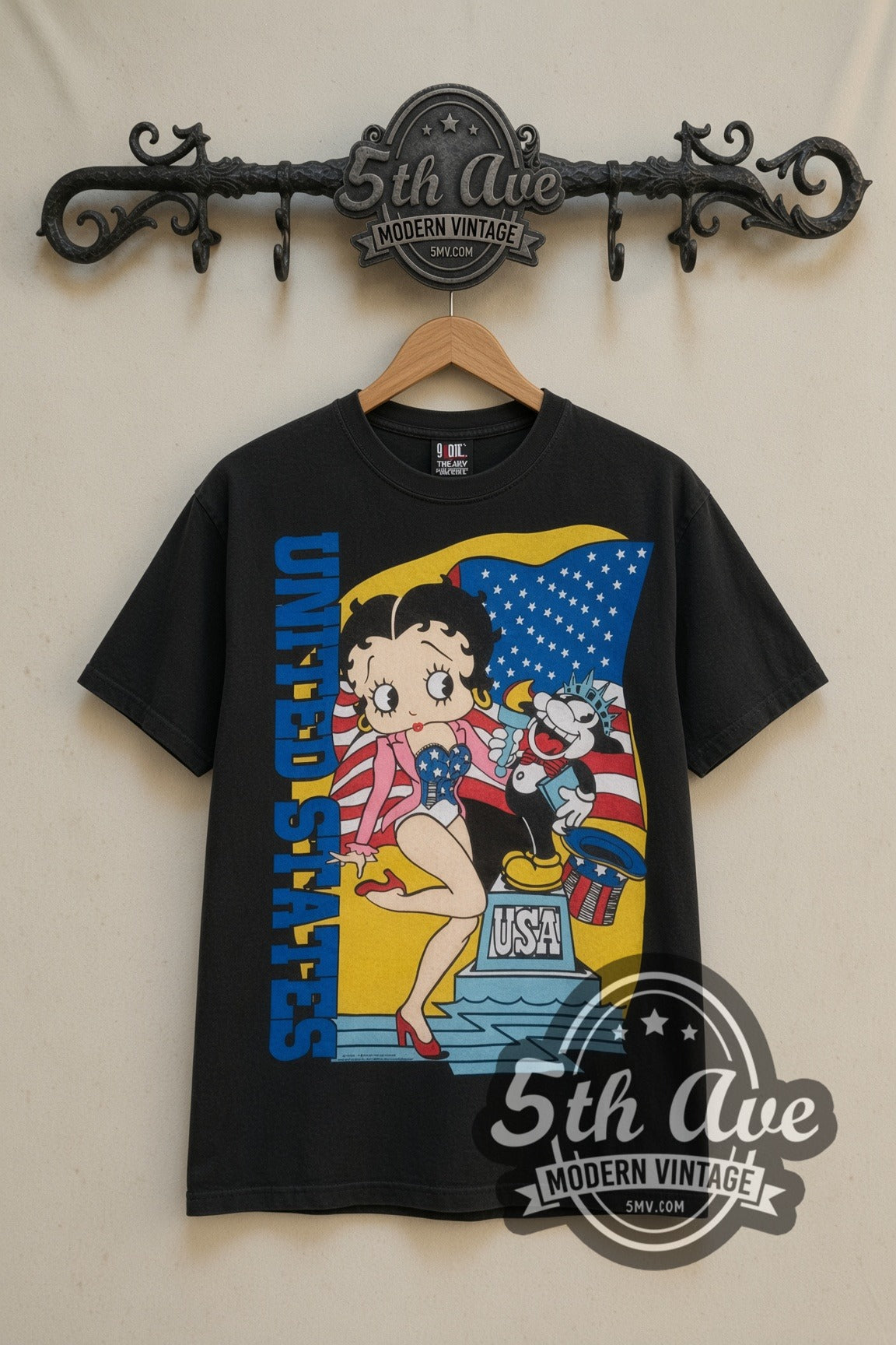 Betty Boop USA Statue of Liberty cartoon tee in black, front view on a display rack