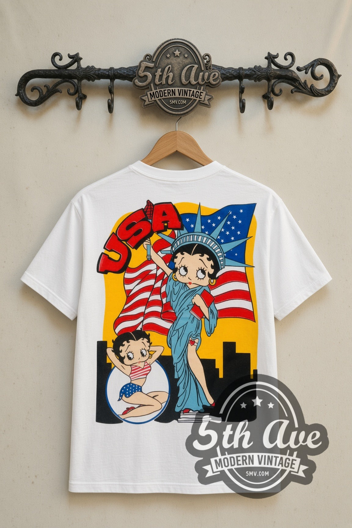 Betty Boop USA Statue of Liberty cartoon tee in white, back view on a display rack