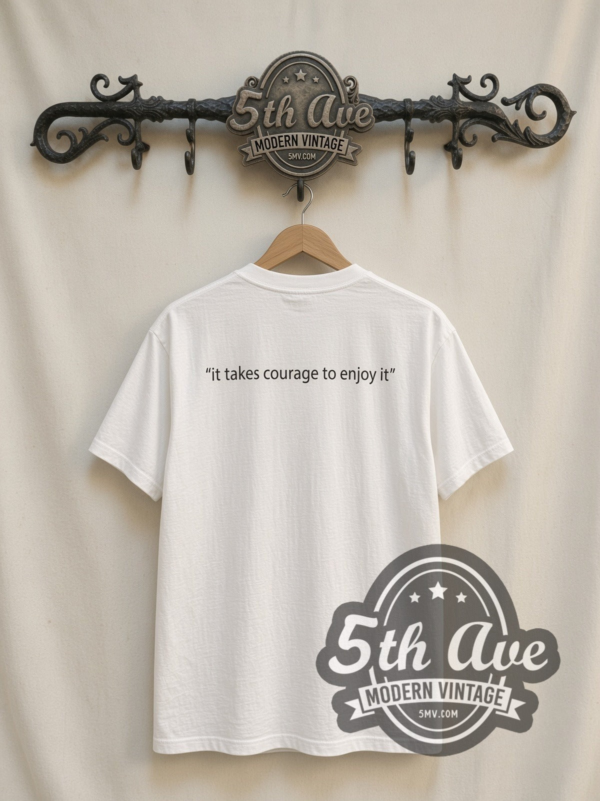 Björk It Takes Courage to Enjoy It vintage band t-shirt, back view on a display rack