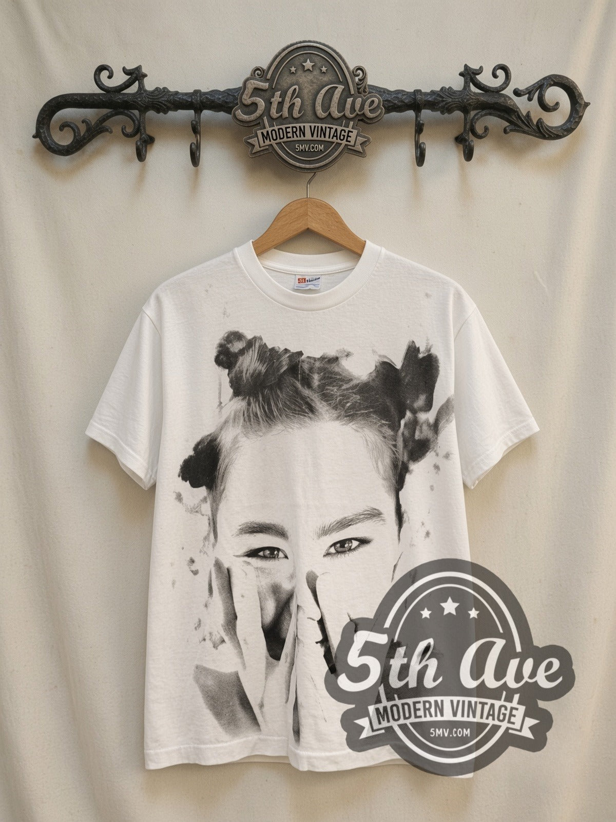Björk It Takes Courage to Enjoy It vintage band t-shirt, front view on a display rack