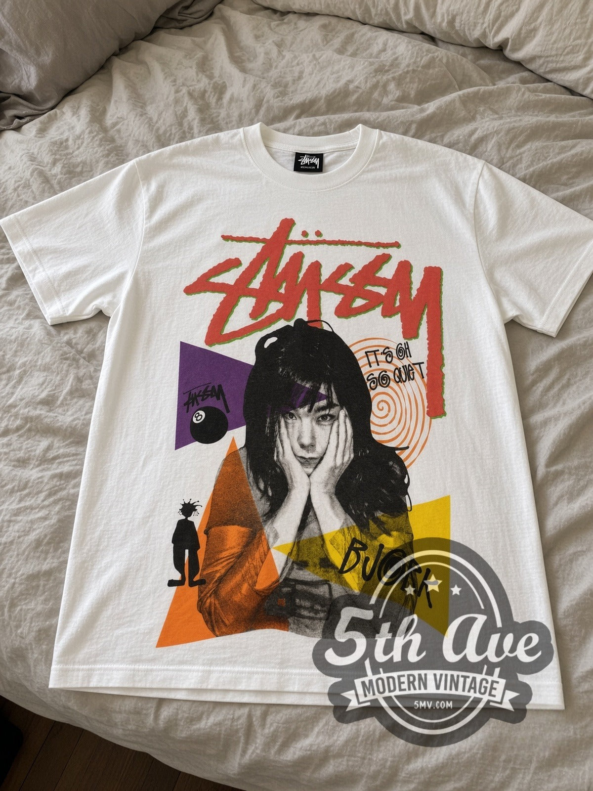 Björk × Stüssy It's Oh So Quiet vintage band t-shirt laid flat on a bed, front artwork