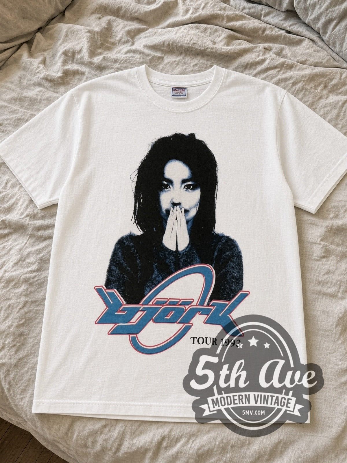 White Björk Tour 1993 band tee laid flat on linen bed