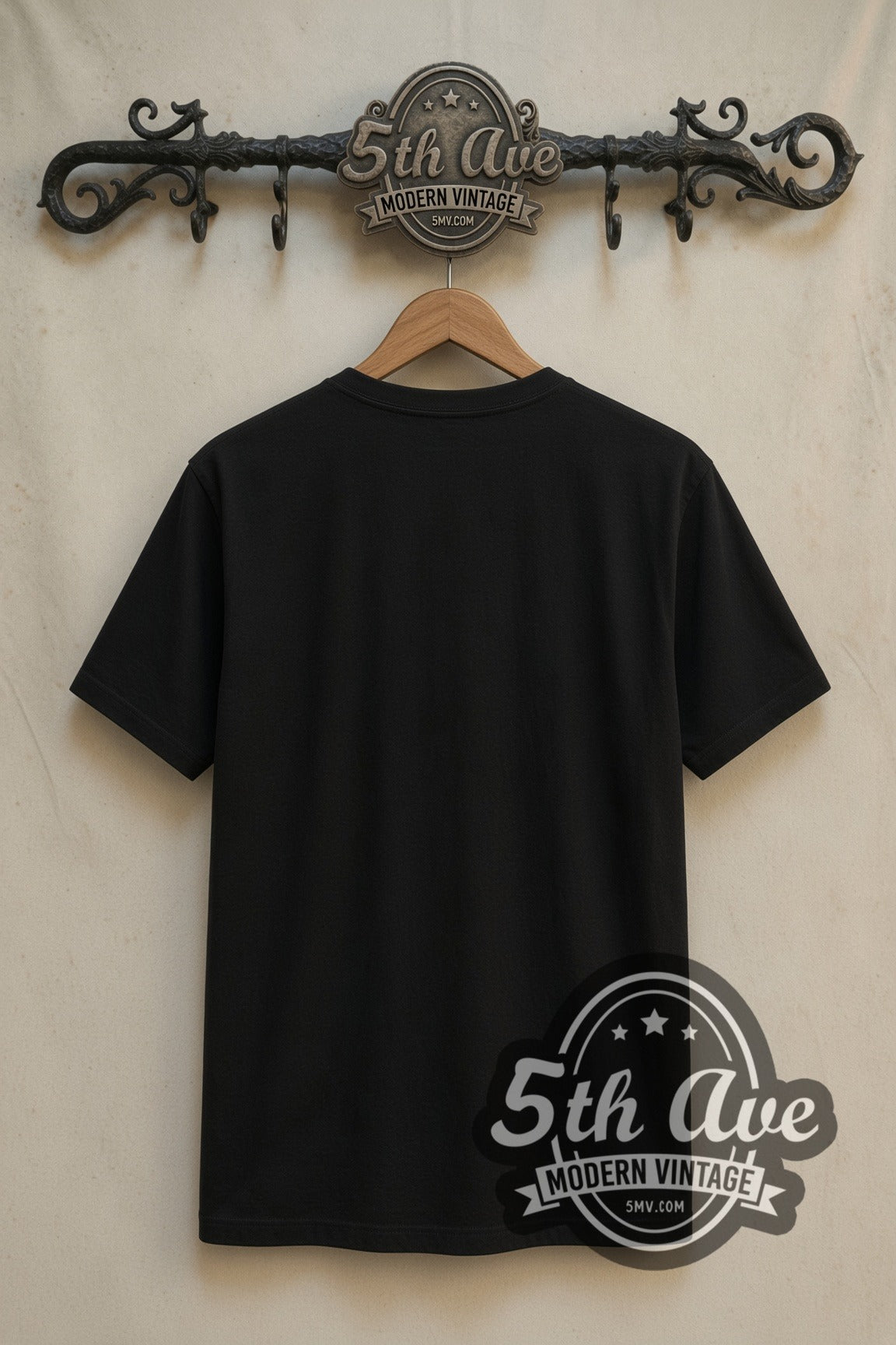 Plain black back of Black Adam double stitched tee on rack
