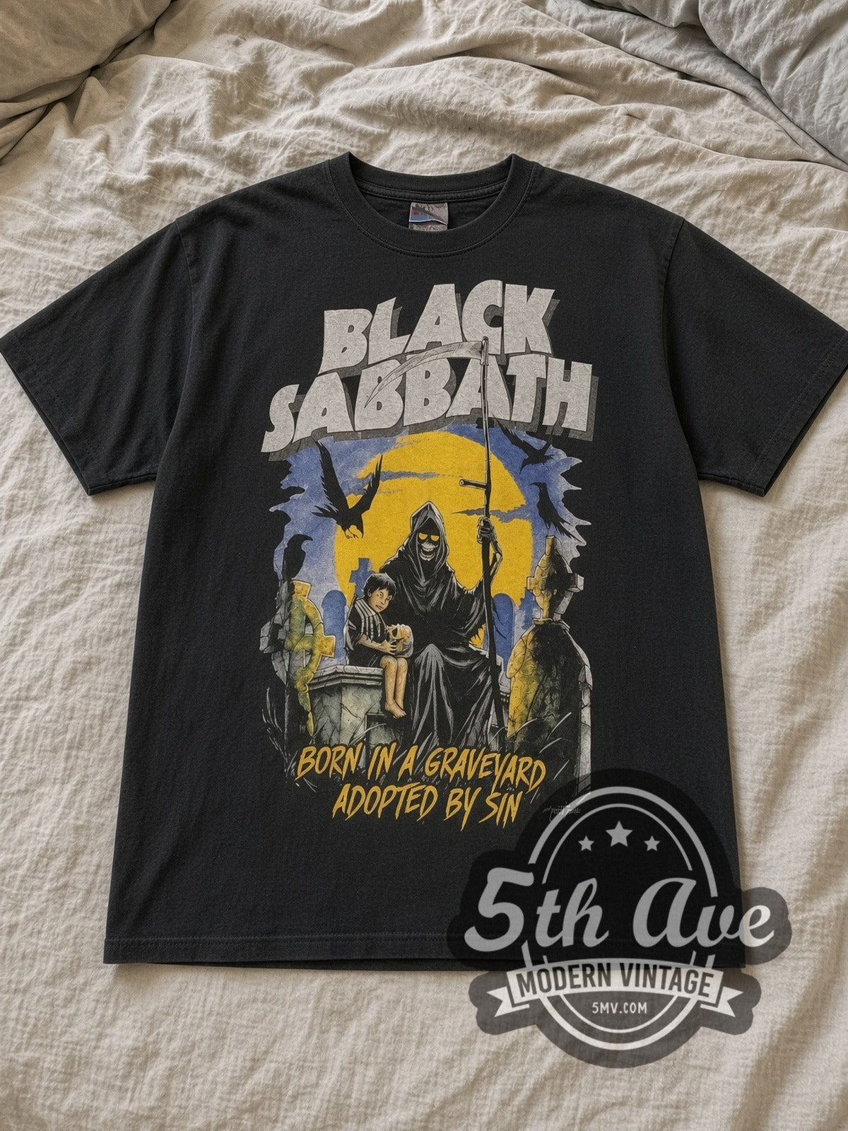 Black Sabbath Never Say Die Live on Tour 1978 Vintage Band T-Shirt in black, laid flat on a linen bed