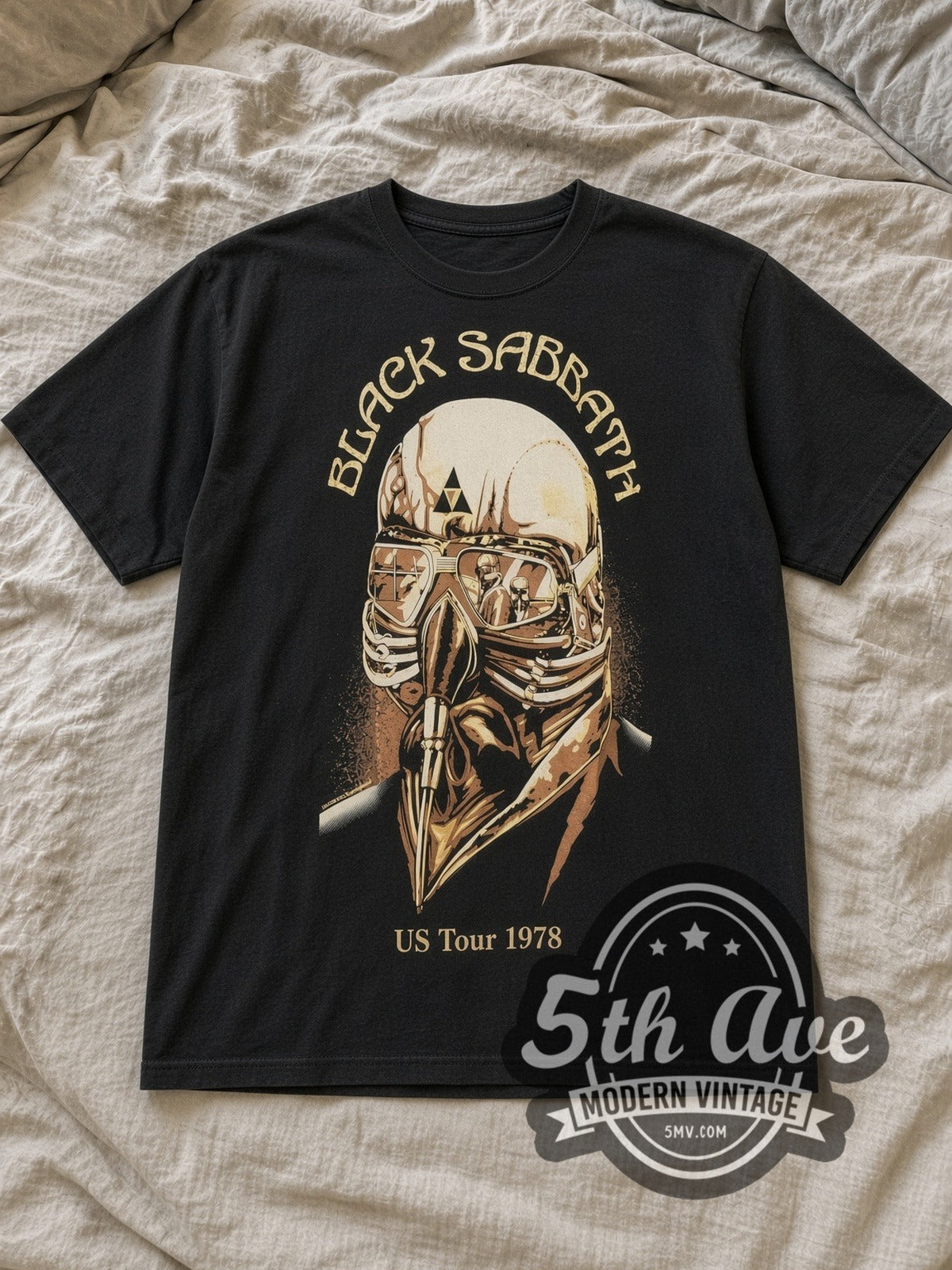 Black Sabbath US Tour 1978 Vintage Band T-Shirt in black, laid flat on a linen bed