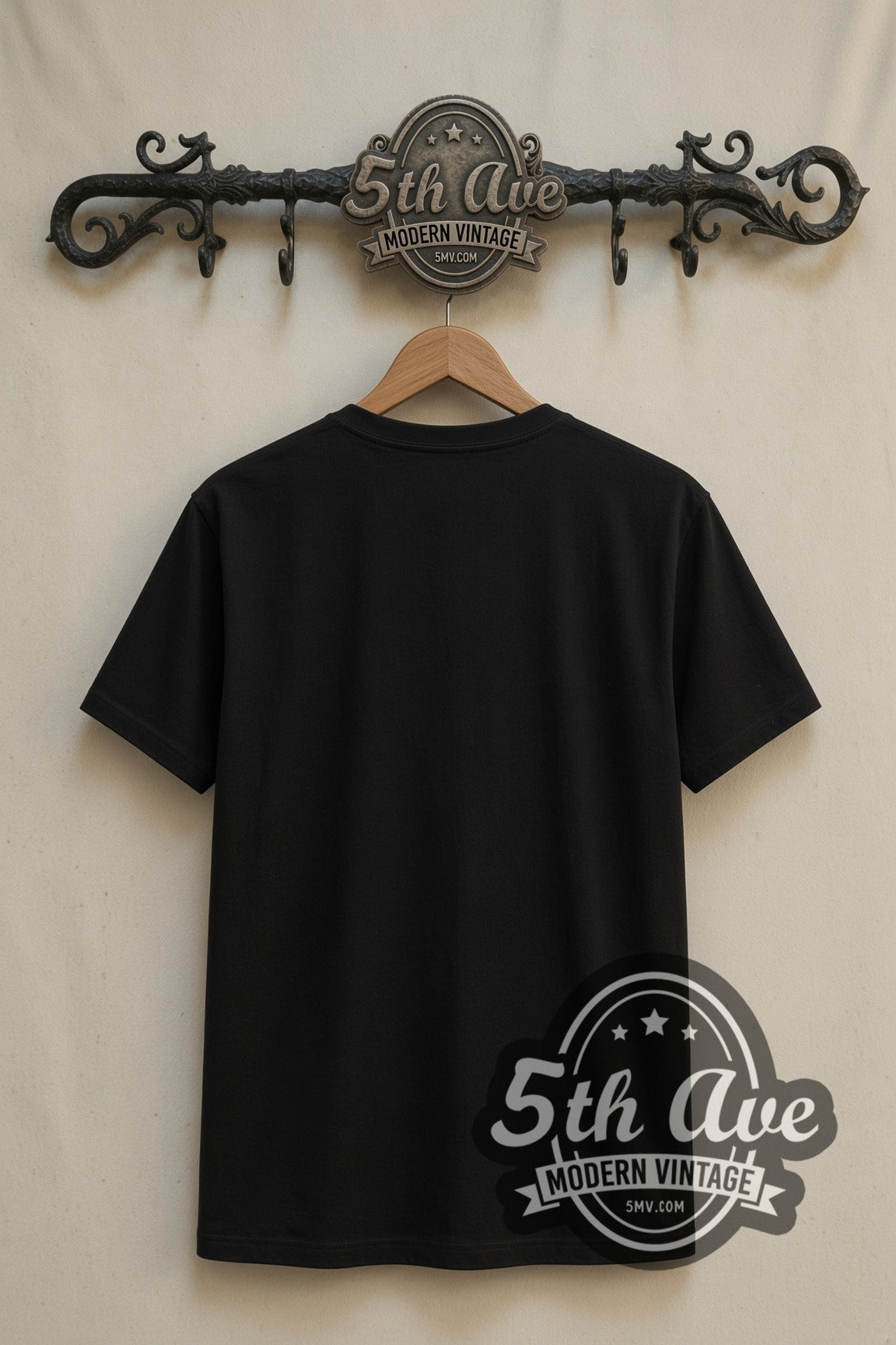 Plain black back of Blue Beetle double stitched tee on rack