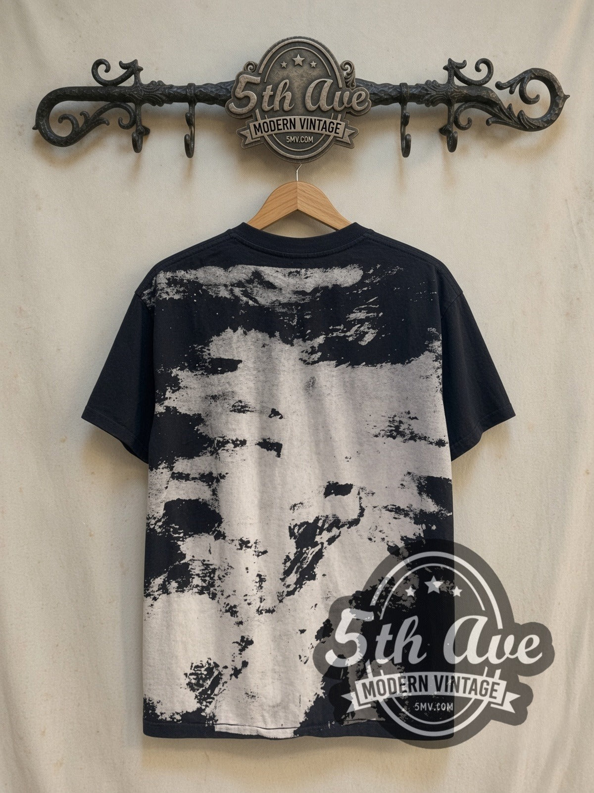 Bob Dylan Blank-Eye Distressed Portrait vintage band t-shirt, back view on a display rack