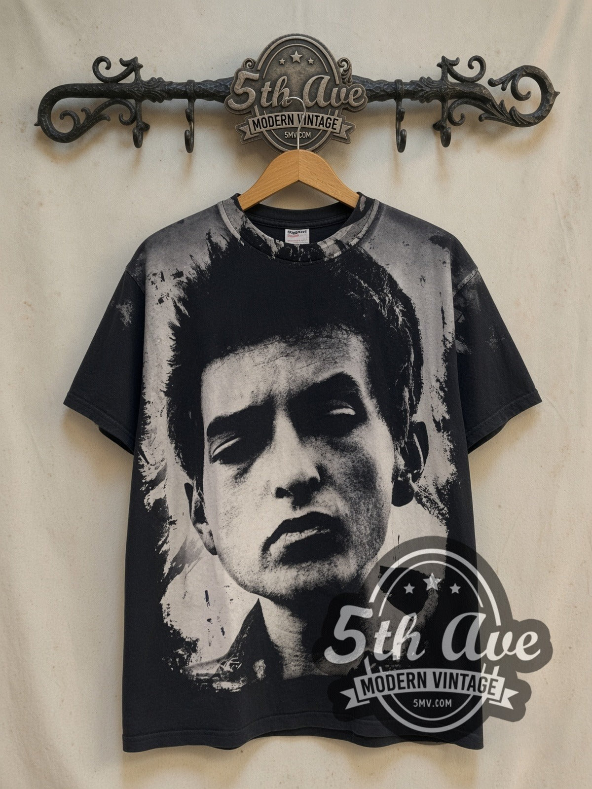 Bob Dylan Blank-Eye Distressed Portrait vintage band t-shirt, front view on a display rack