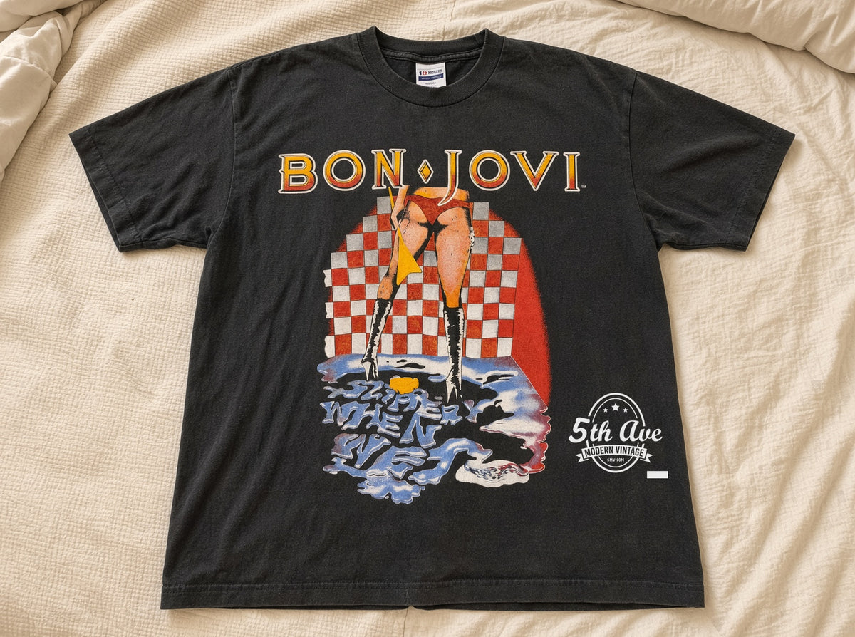 Bon Jovi Slippery When Wet vintage t-shirt laid on bed