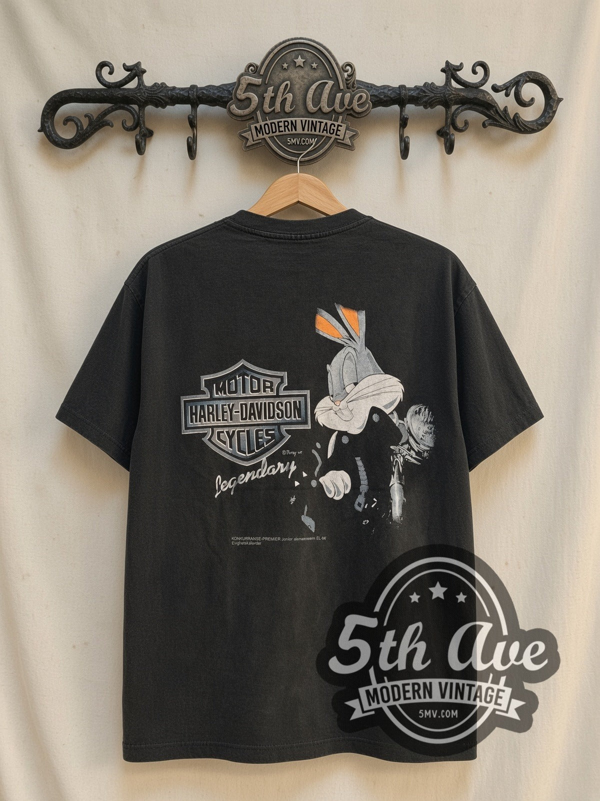 Harley-Davidson x Looney Tunes Victory Belongs To The Most Persevering vintage Harley t-shirt, back view on a display rack