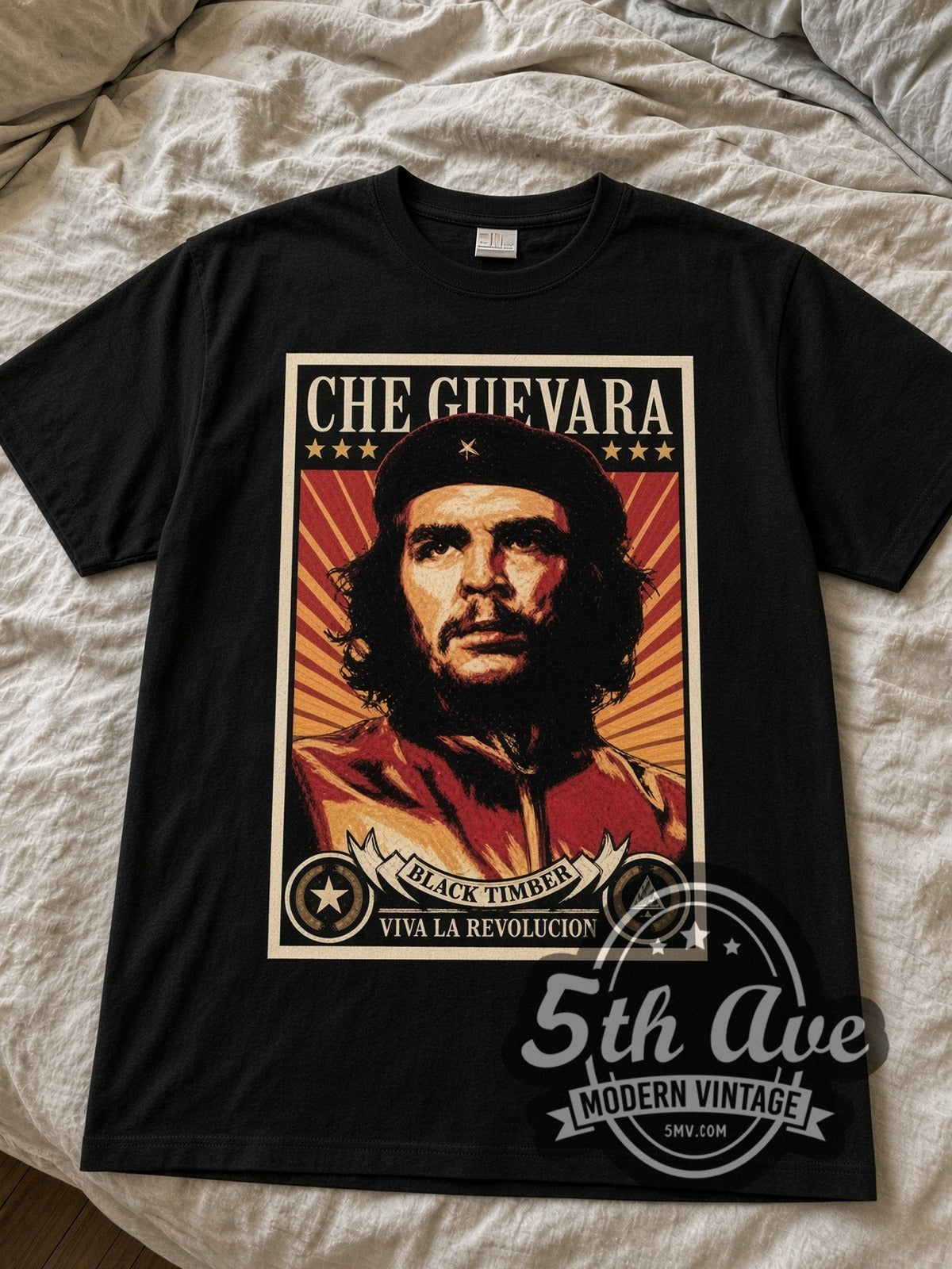 Che Guevara Viva la Revolucion black graphic tee laid flat on linen bed