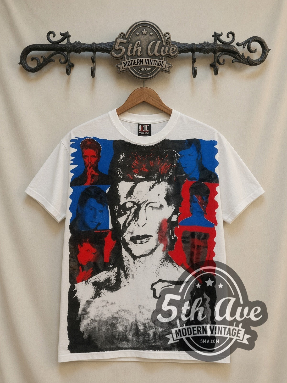 David Bowie Aladdin Sane all-over-print vintage band t-shirt in white, front view on a display rack