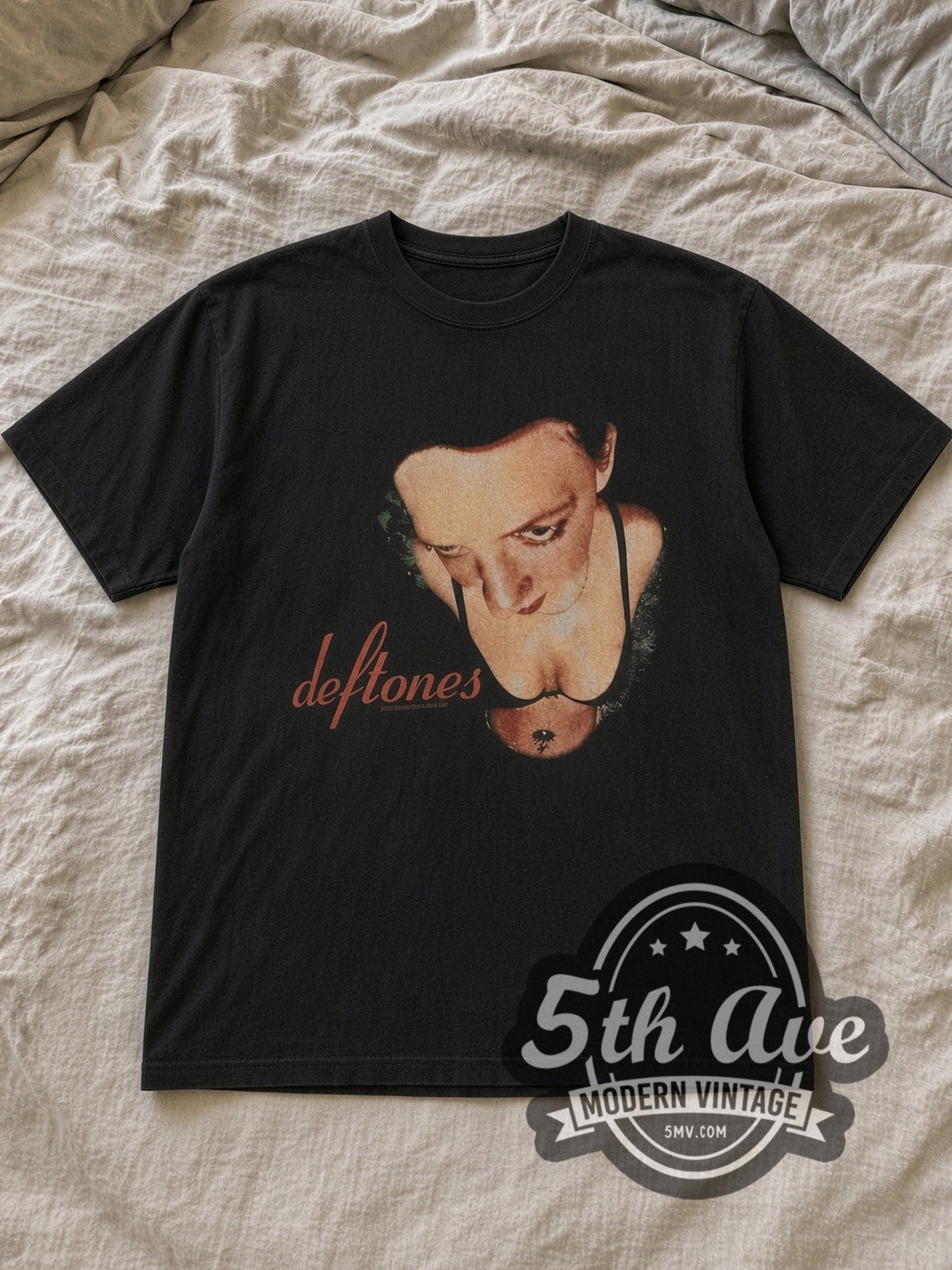 Black Deftones Around the Fur Red Script Logo Vintage Band T-Shirt laid flat on a linen bed