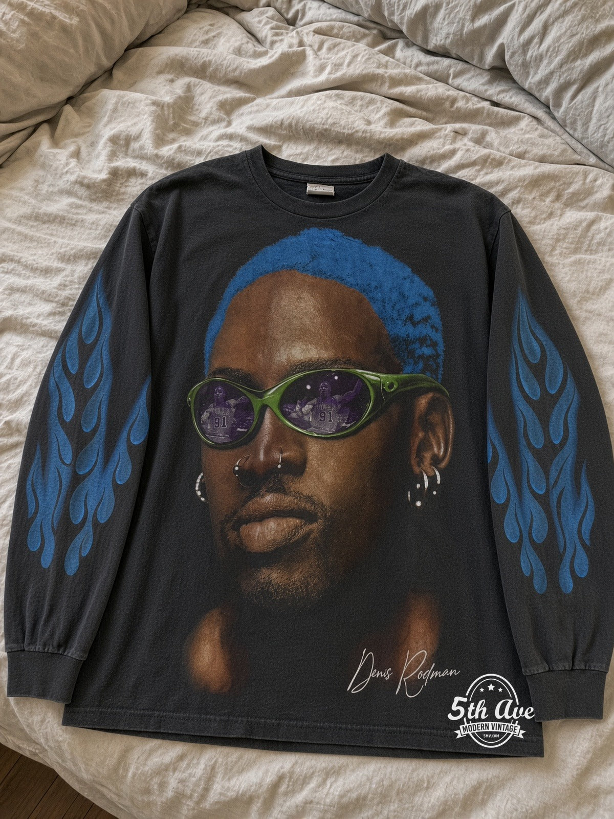Dennis Rodman Just For Rodman Blue Hair Flames LS vintage tee laid on bed
