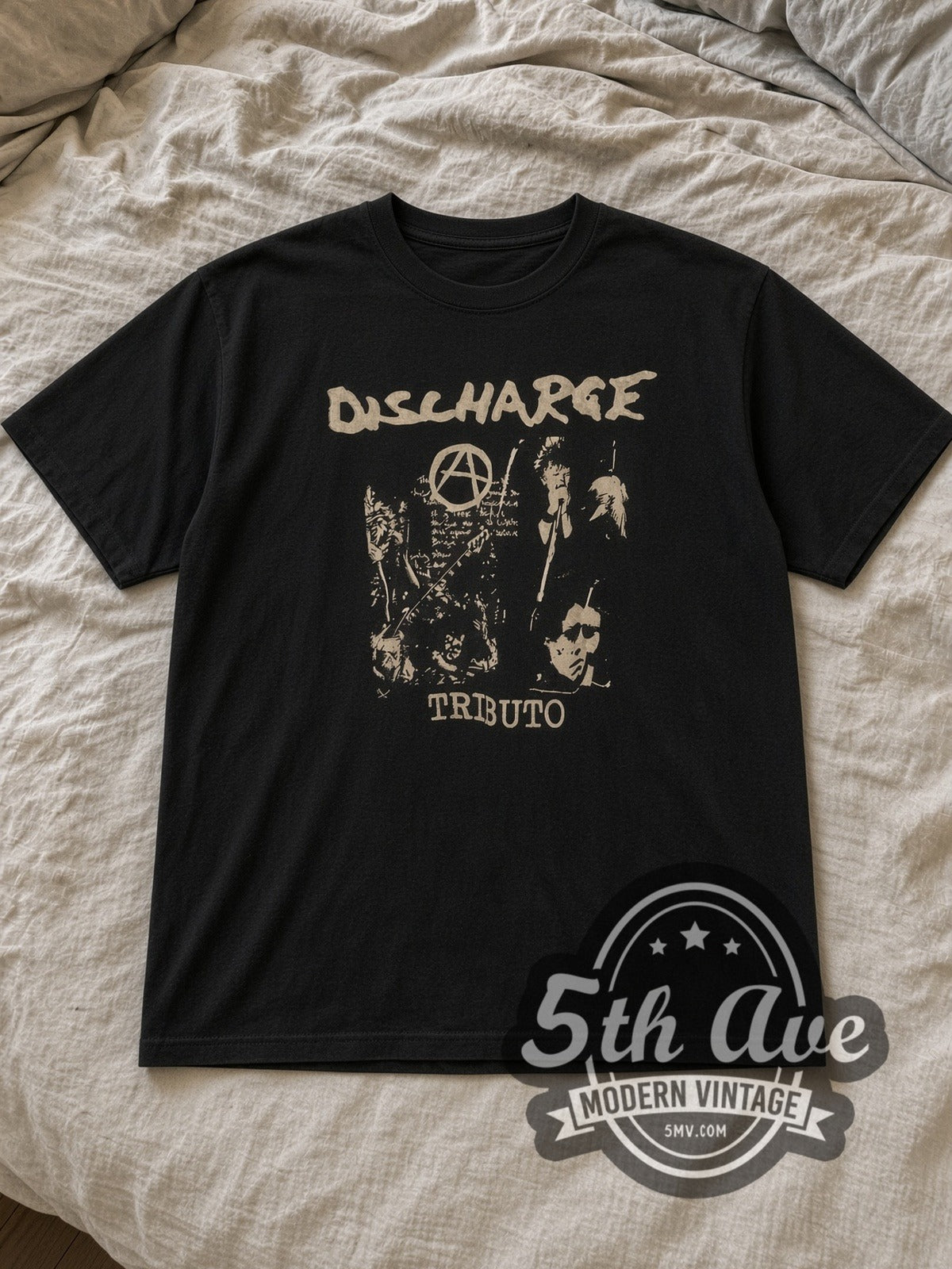 Black Discharge Tributo Vintage Band T-Shirt laid flat on a linen bed