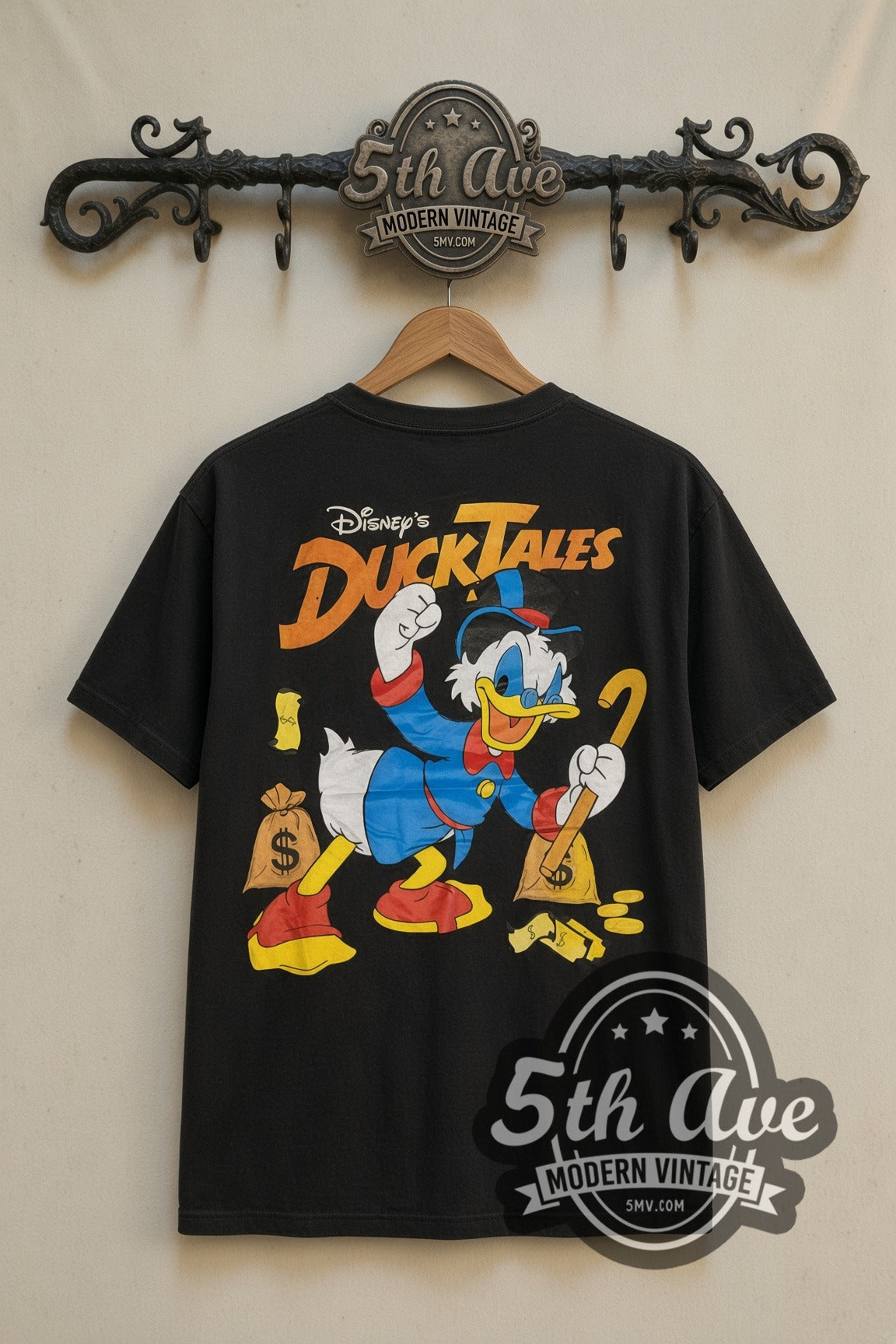 Disney Donald Duck Cowboy and DuckTales Scrooge cartoon tee in black, back view on a display rack