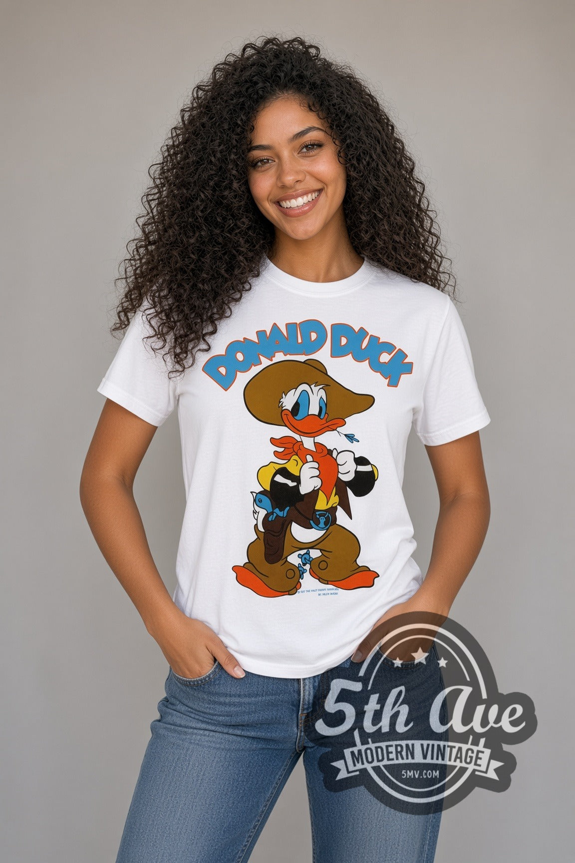 Model wearing the Disney Donald Duck Cowboy and DuckTales Scrooge cartoon tee in white