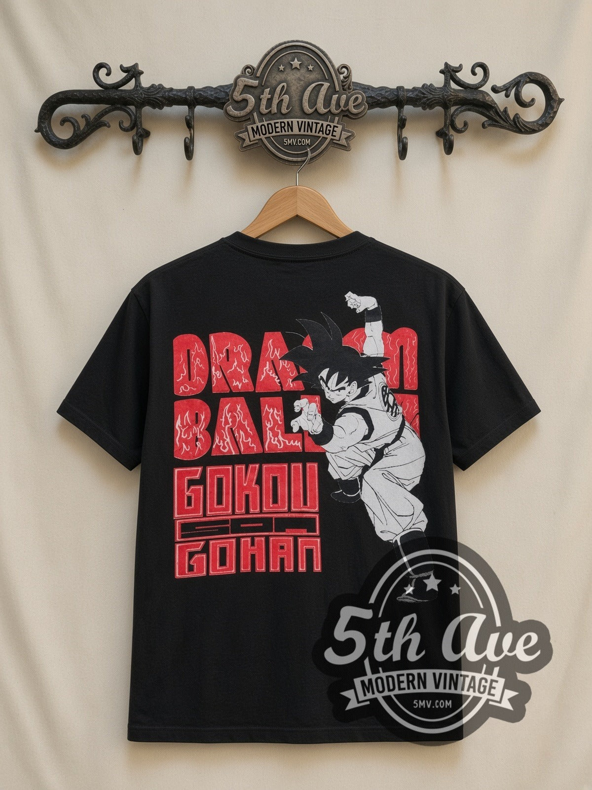 Dragon Ball Z Goku Super Saiyan Forms all-over-print vintage cartoon t-shirt in black, back view on a display rack