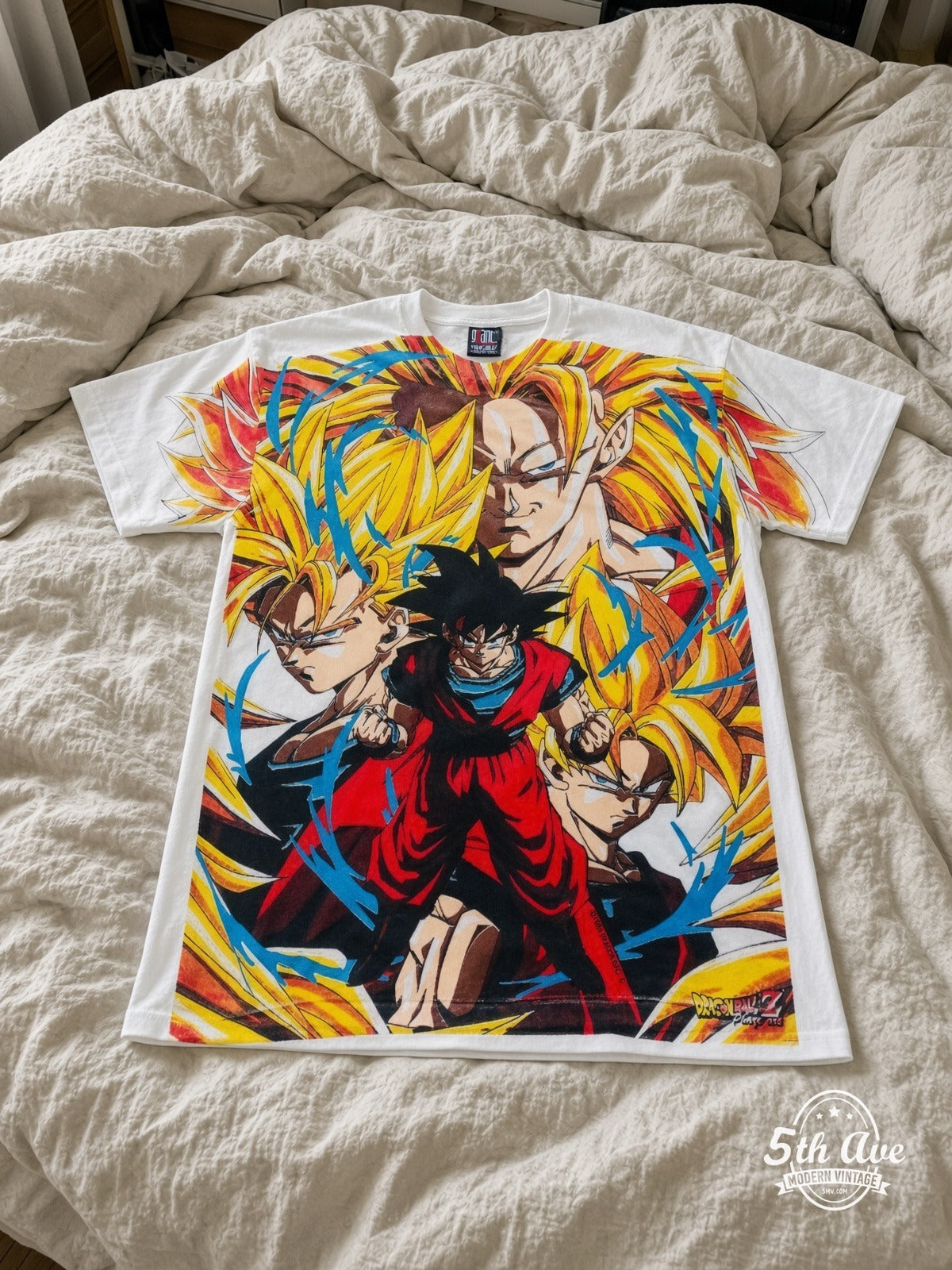Dragon Ball Z Goku Super Saiyan Forms vintage tee laid on bed