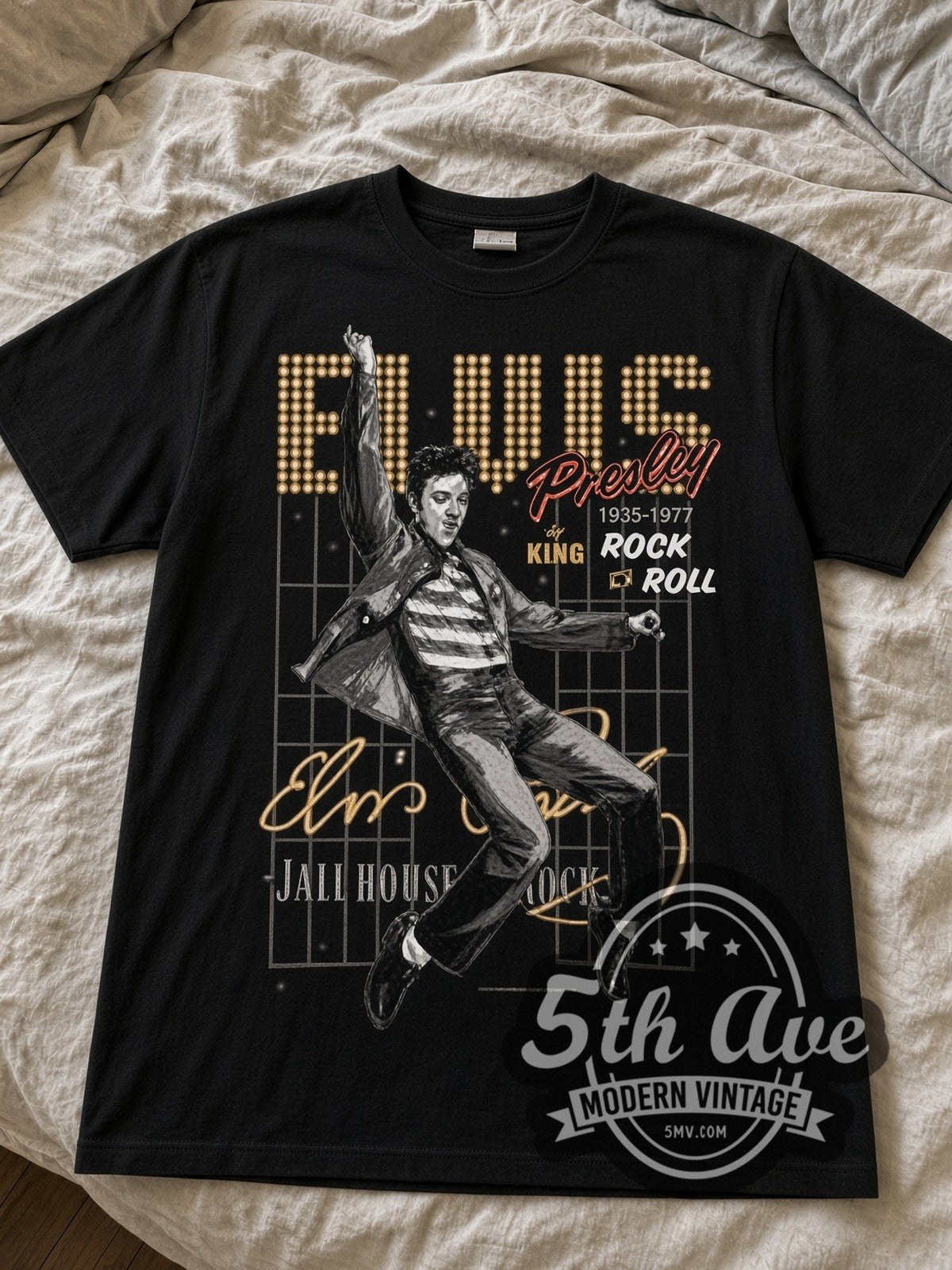 Elvis Presley Jailhouse Rock black graphic tee laid flat on linen bed