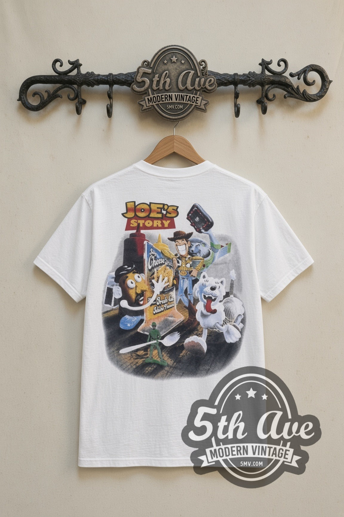 Eskimo Joe's Stillwater Joes Story cartoon tee in white, back view on a display rack