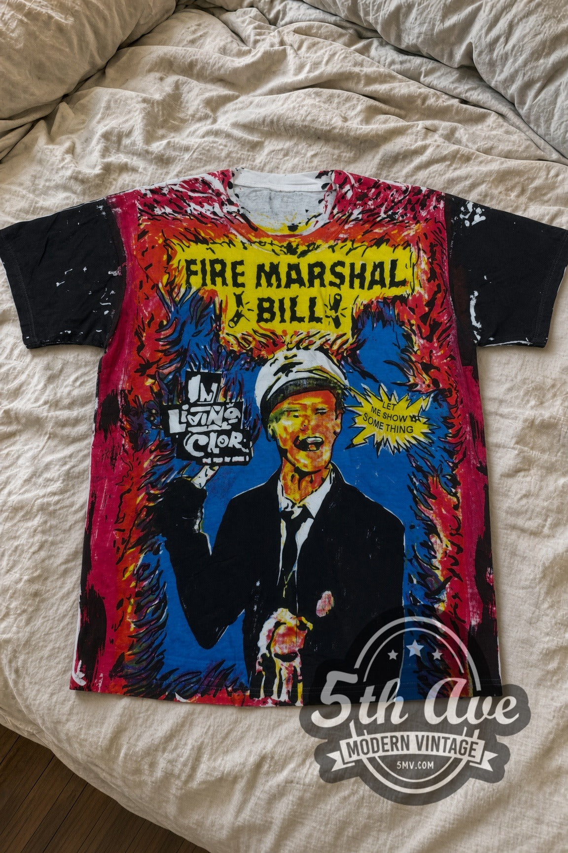 Fire Marshal Bill In Living Color all-over-print vintage movie t-shirt laid flat on a bed