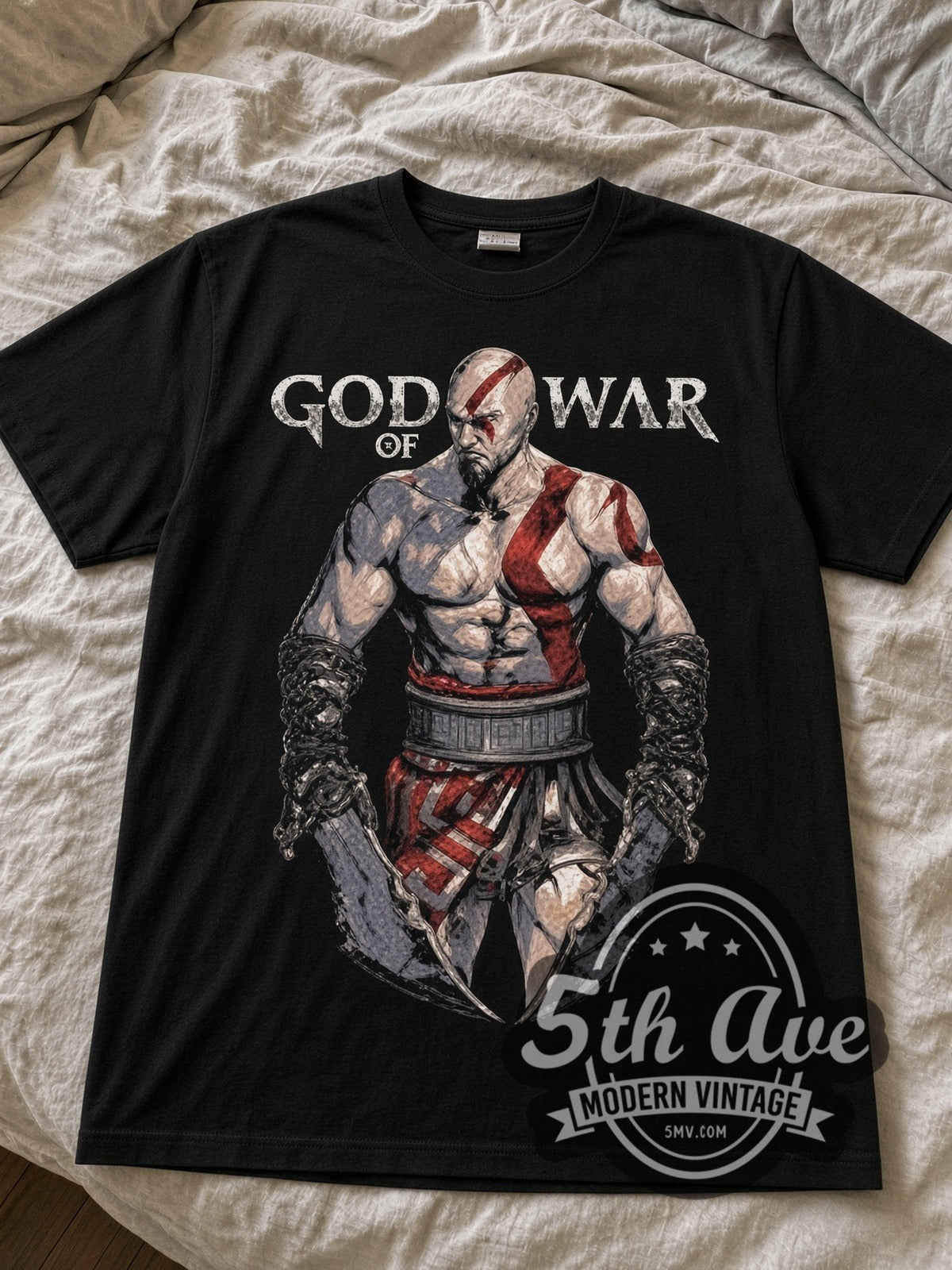 God of War Kratos black graphic tee laid flat on linen bed